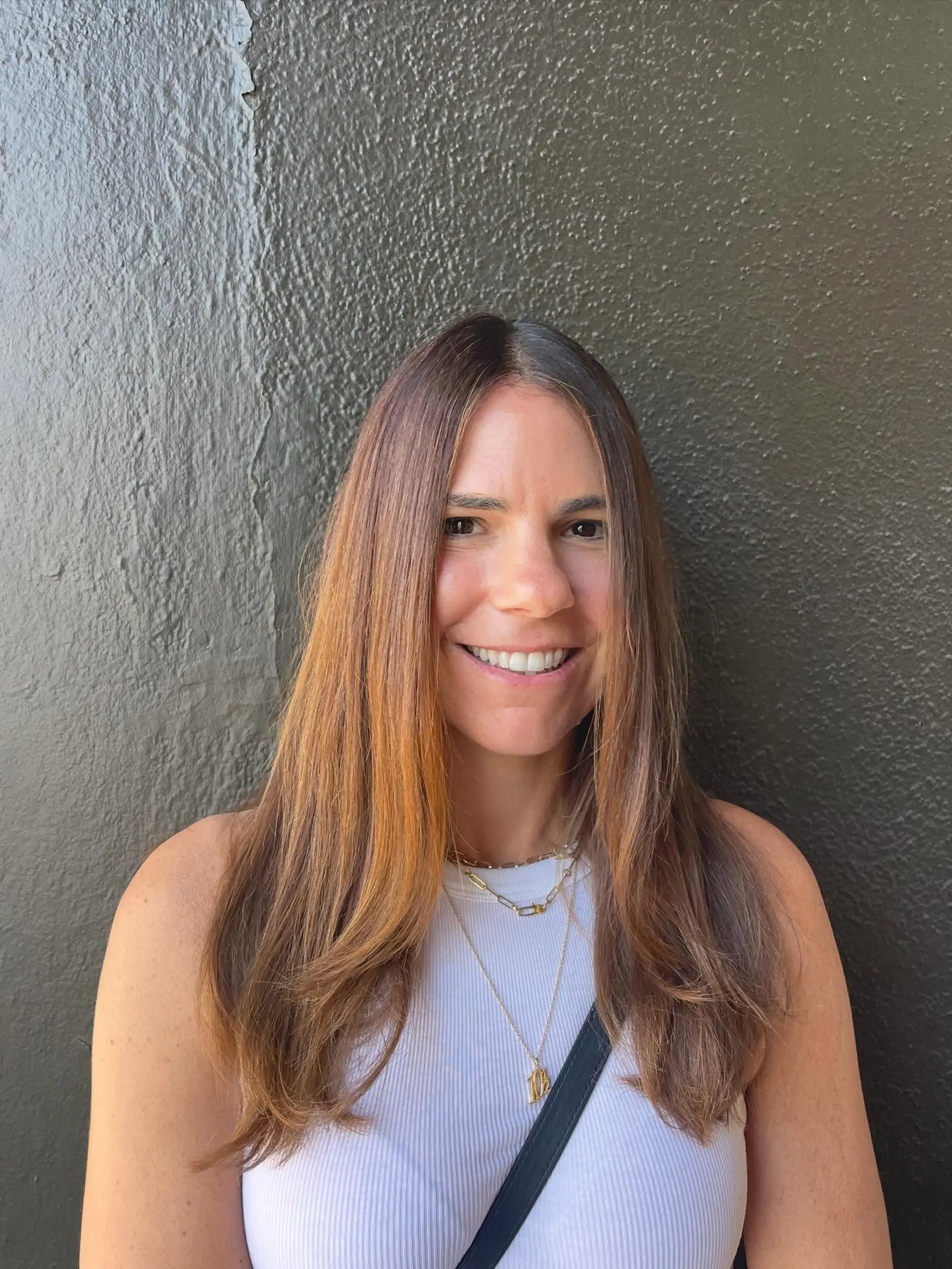 Long, layered hair with caramel balayage. 1