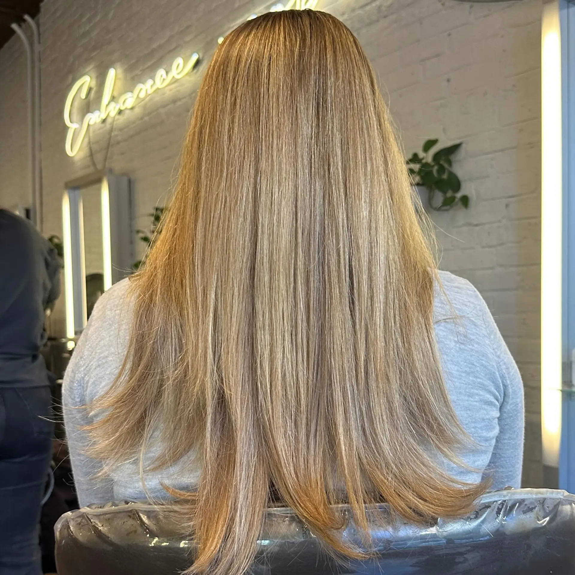 Long, layered wavy hairstyle with copper and auburn balayage highlights. 2