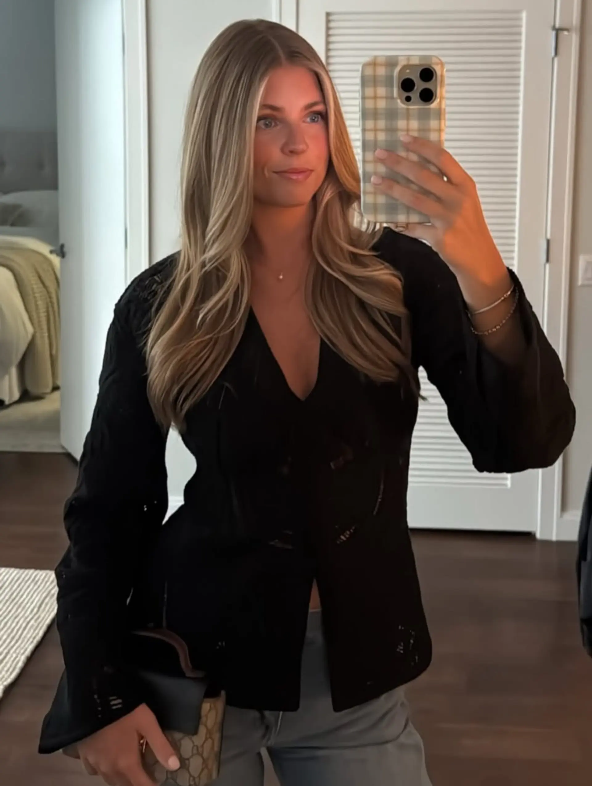 Long center-parted blonde hair styled with smooth, lived-in loose waves. 1