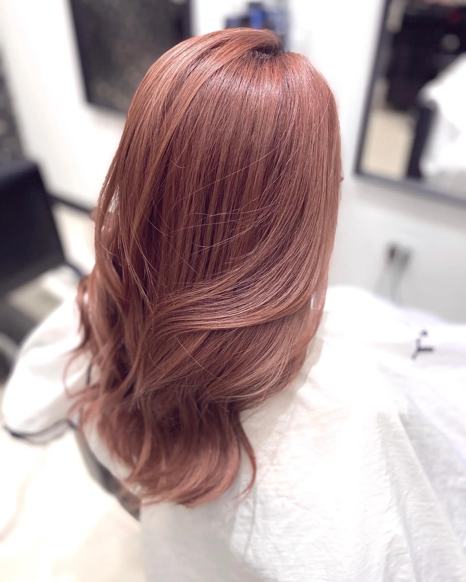 A rose gold balayage with loose waves for a trendy and romantic look. 2