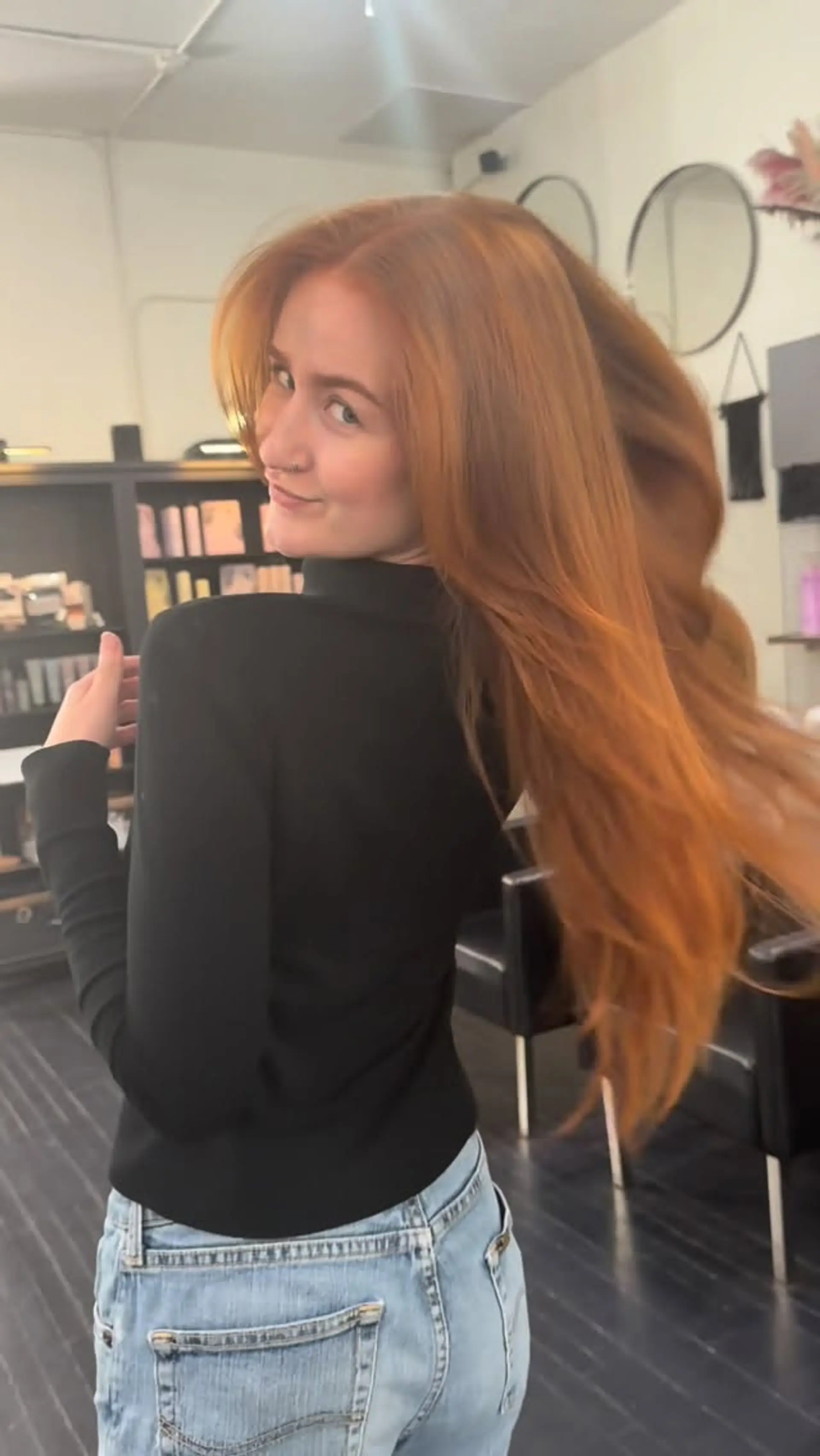 Vibrant copper red long hair styled with a smooth, dynamic blowout. 1