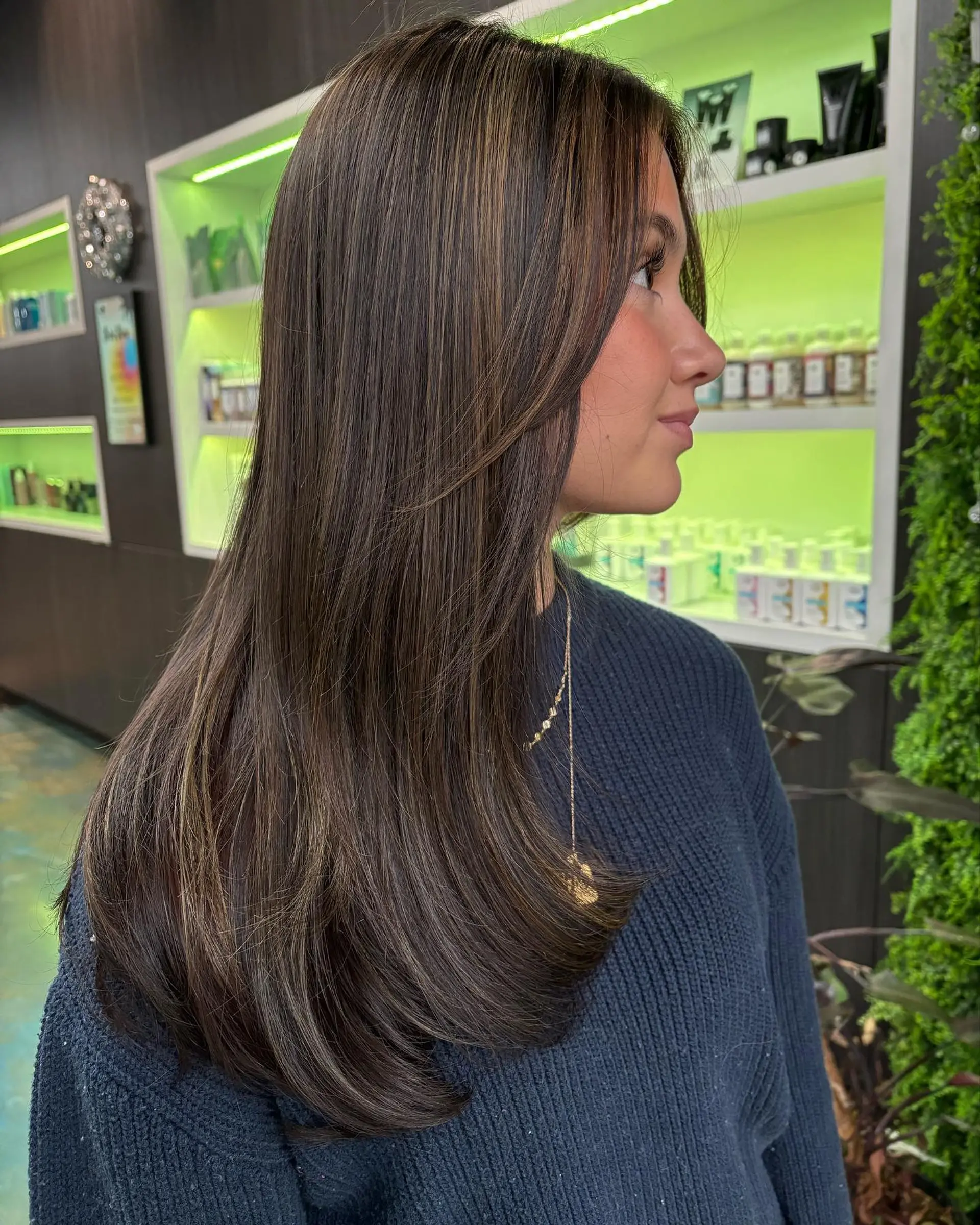 A long, layered hairstyle with subtle highlights. 1