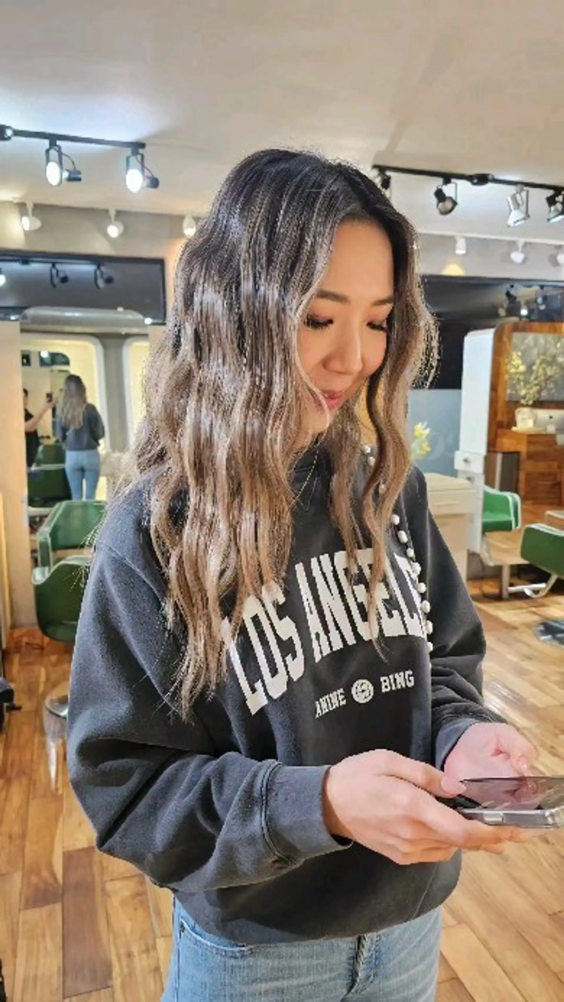 Long dimensional bronde hair styled with subtle textured crimp waves. 1