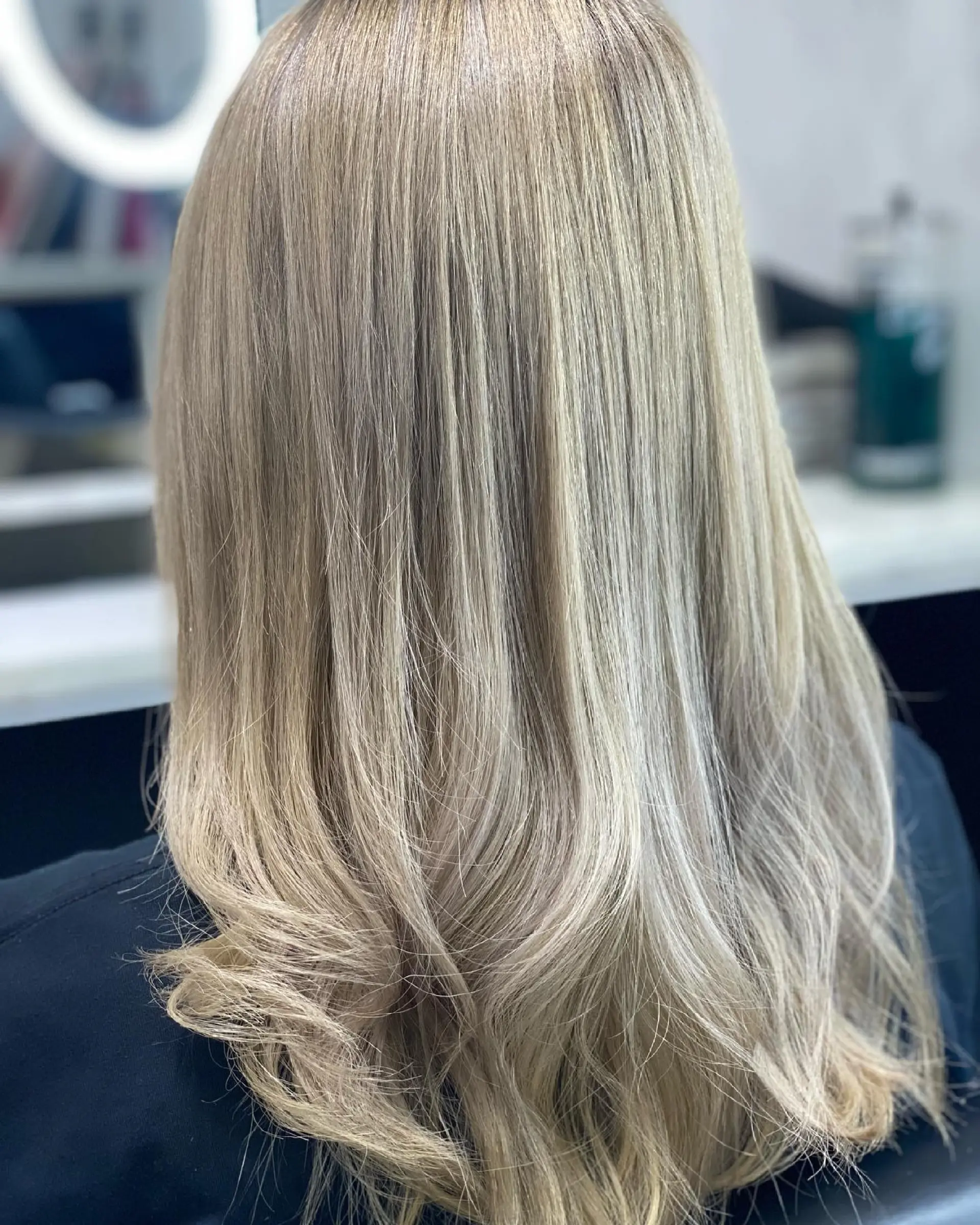 Long, straight hair with a light brown to blonde balayage that creates a dimensional and beachy effect. 1