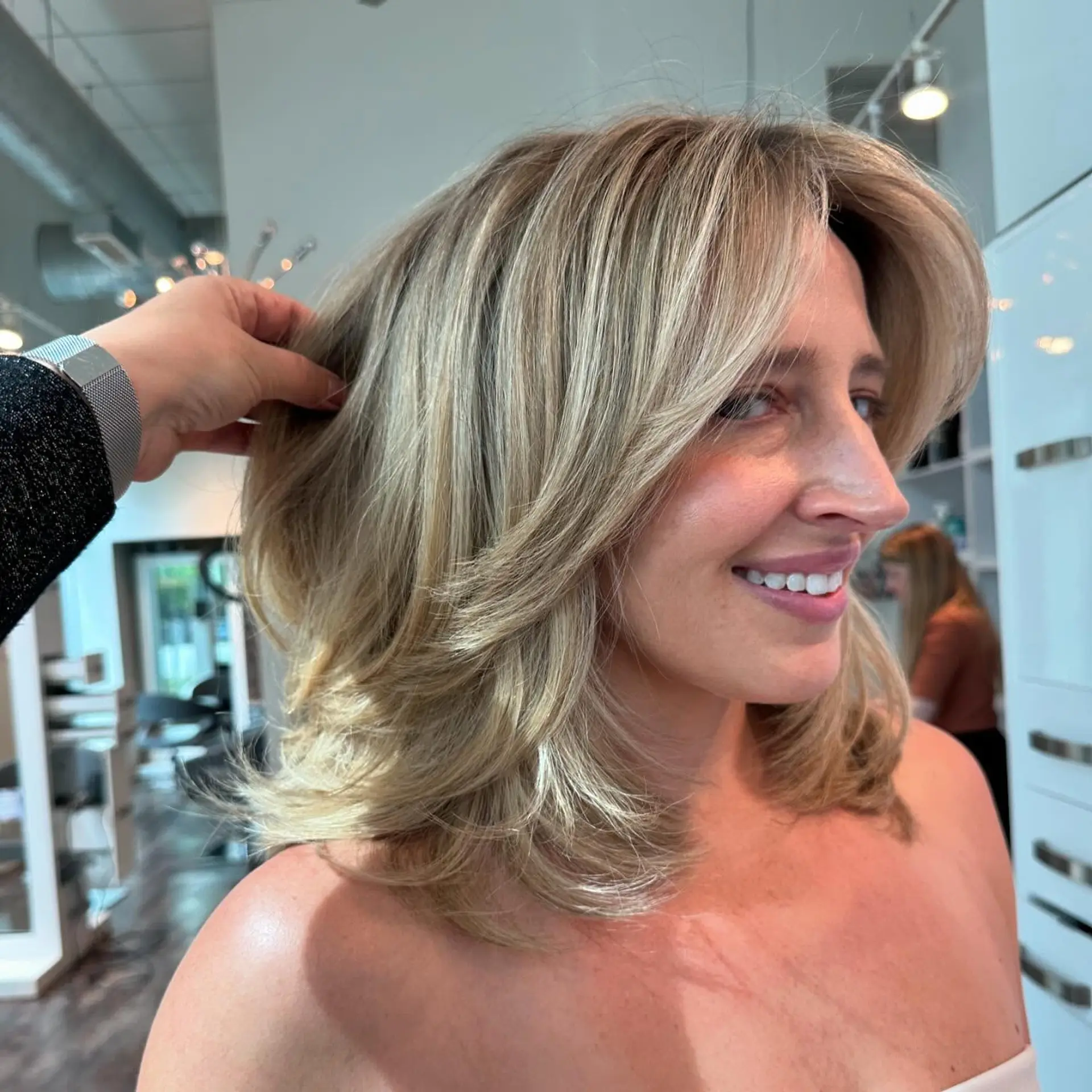 A stylish medium-length bob with soft layers for added volume and movement. 2