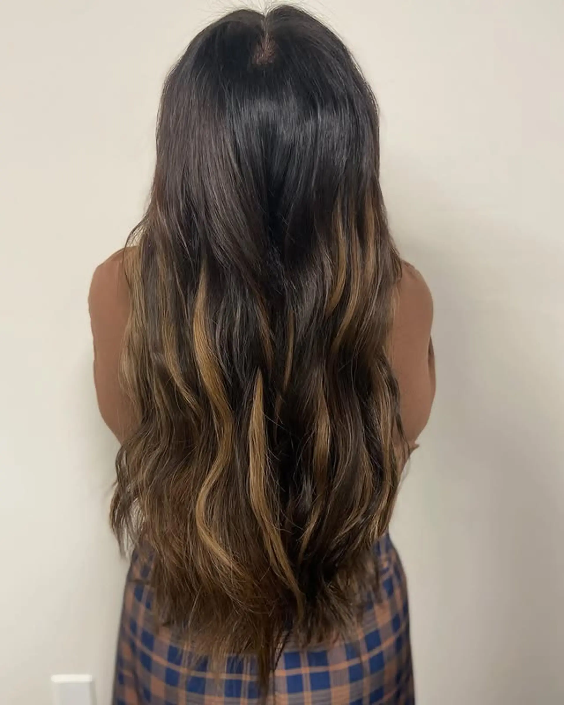 Long, layered waves with caramel highlights. 1