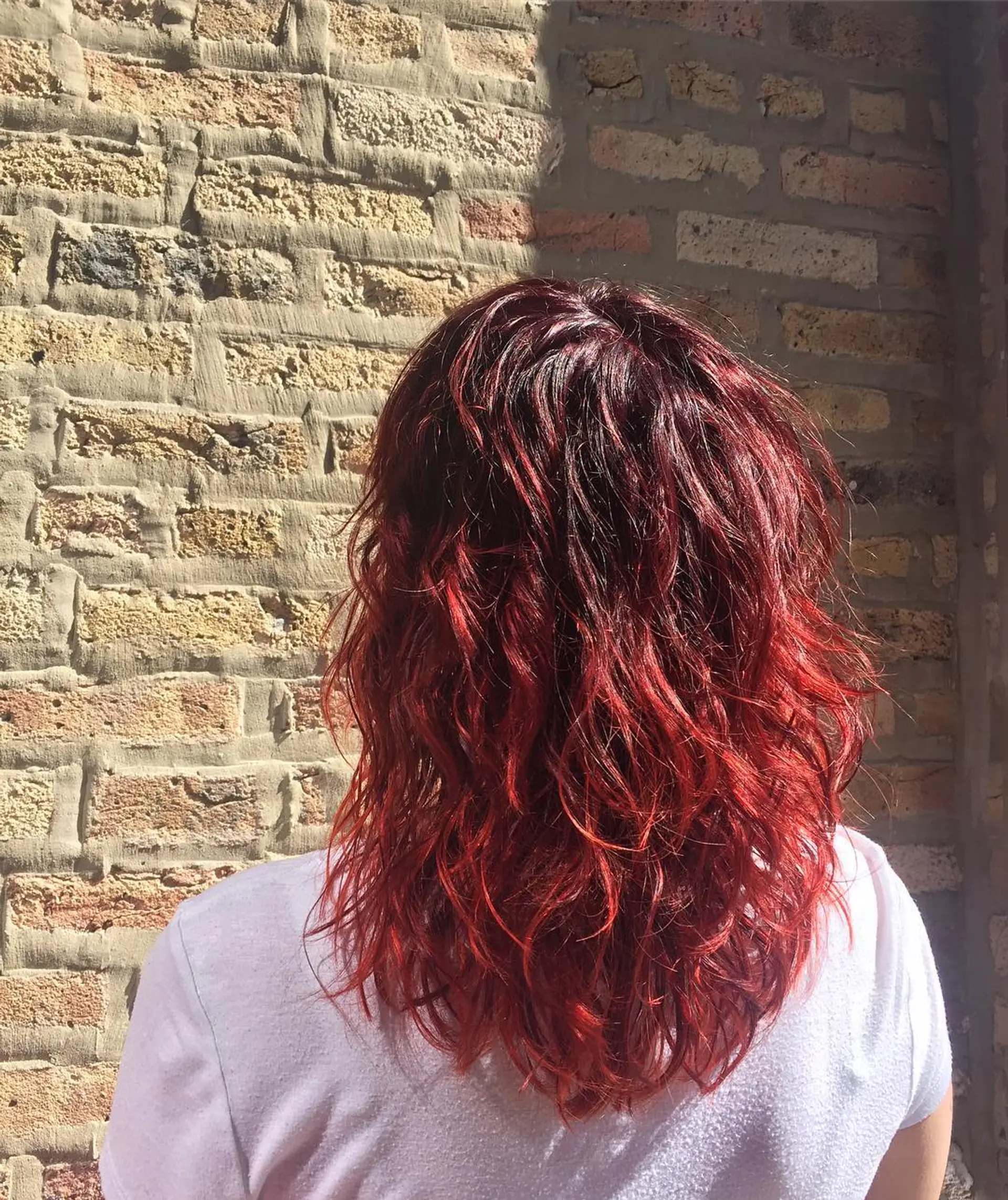 A layered medium-length cut that enhances natural waves and creates a textured look. 1