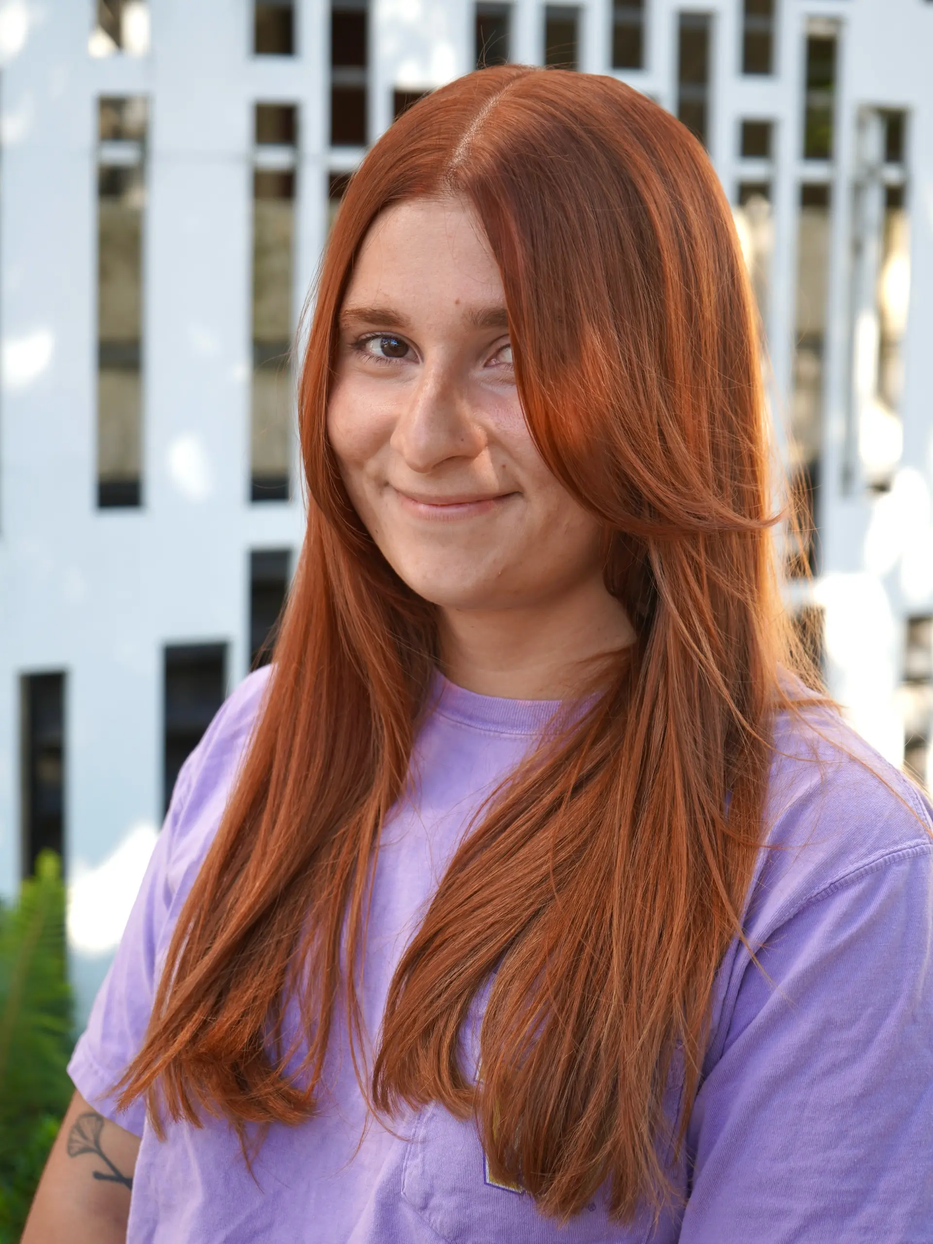 Long straight copper hair styled with a center part and face-framing curtain layers. 1