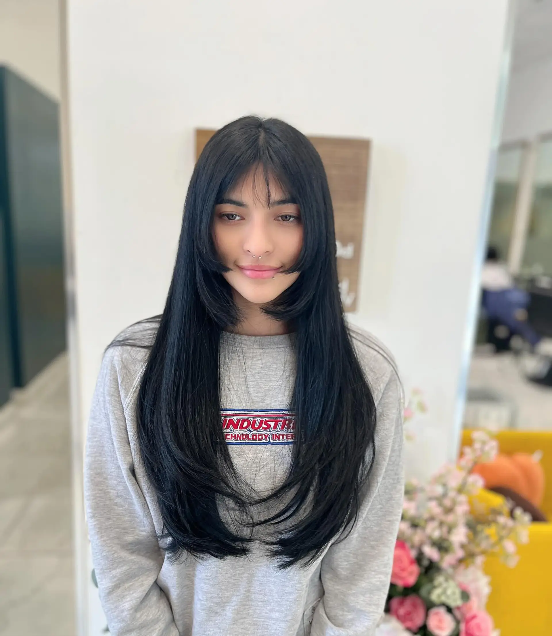 A long straight black hairstyle featuring a modern hime cut with cheek-length face-framing sections, wispy bangs, and long inward-curling layers. 1