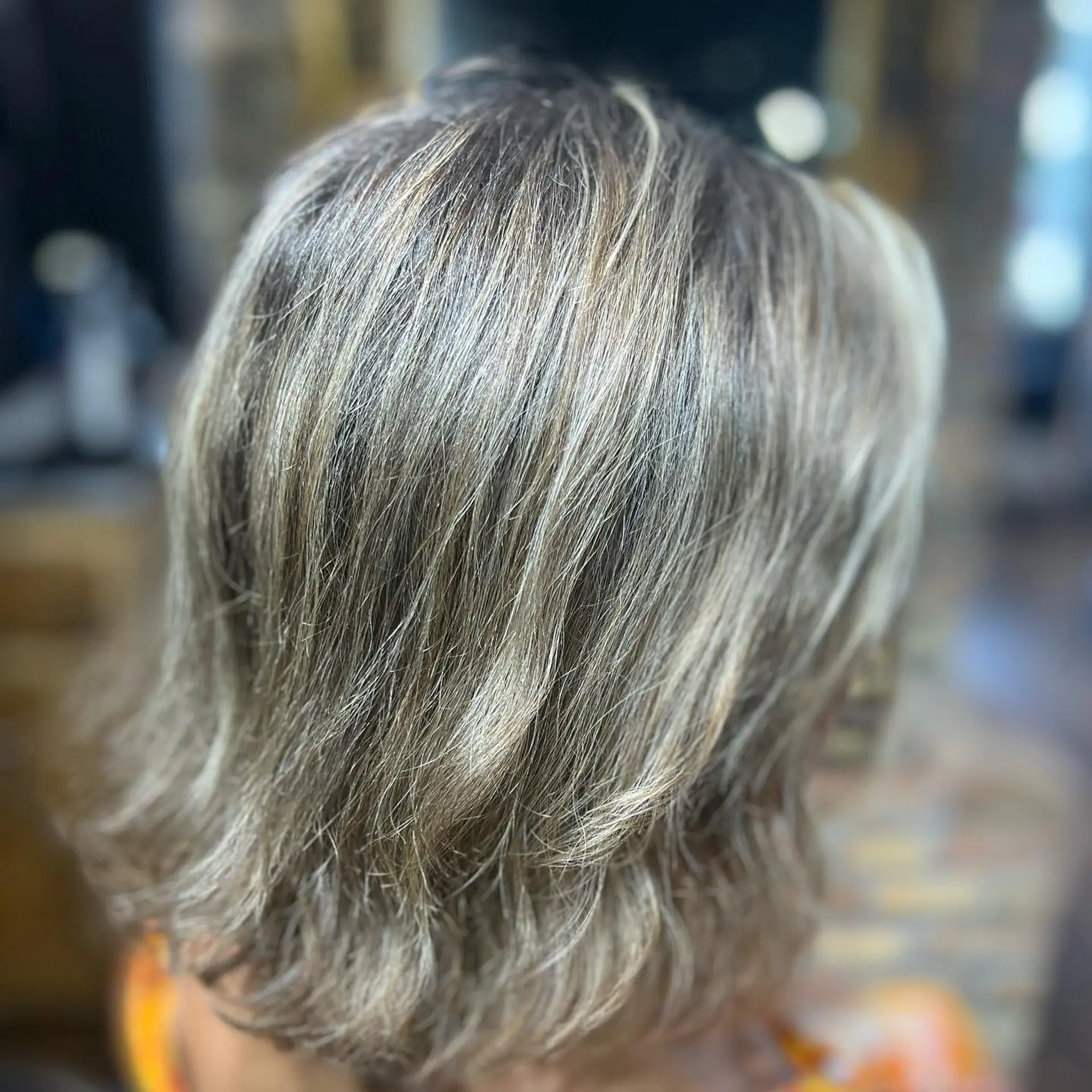 A textured, wavy bob with vibrant dimensional highlights. 2