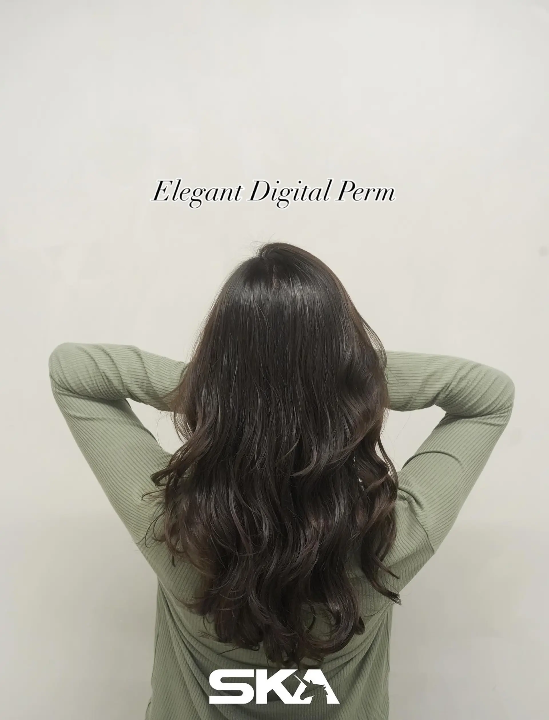 Long dark hair styled with soft, cascading digital perm waves and subtle layers. 1