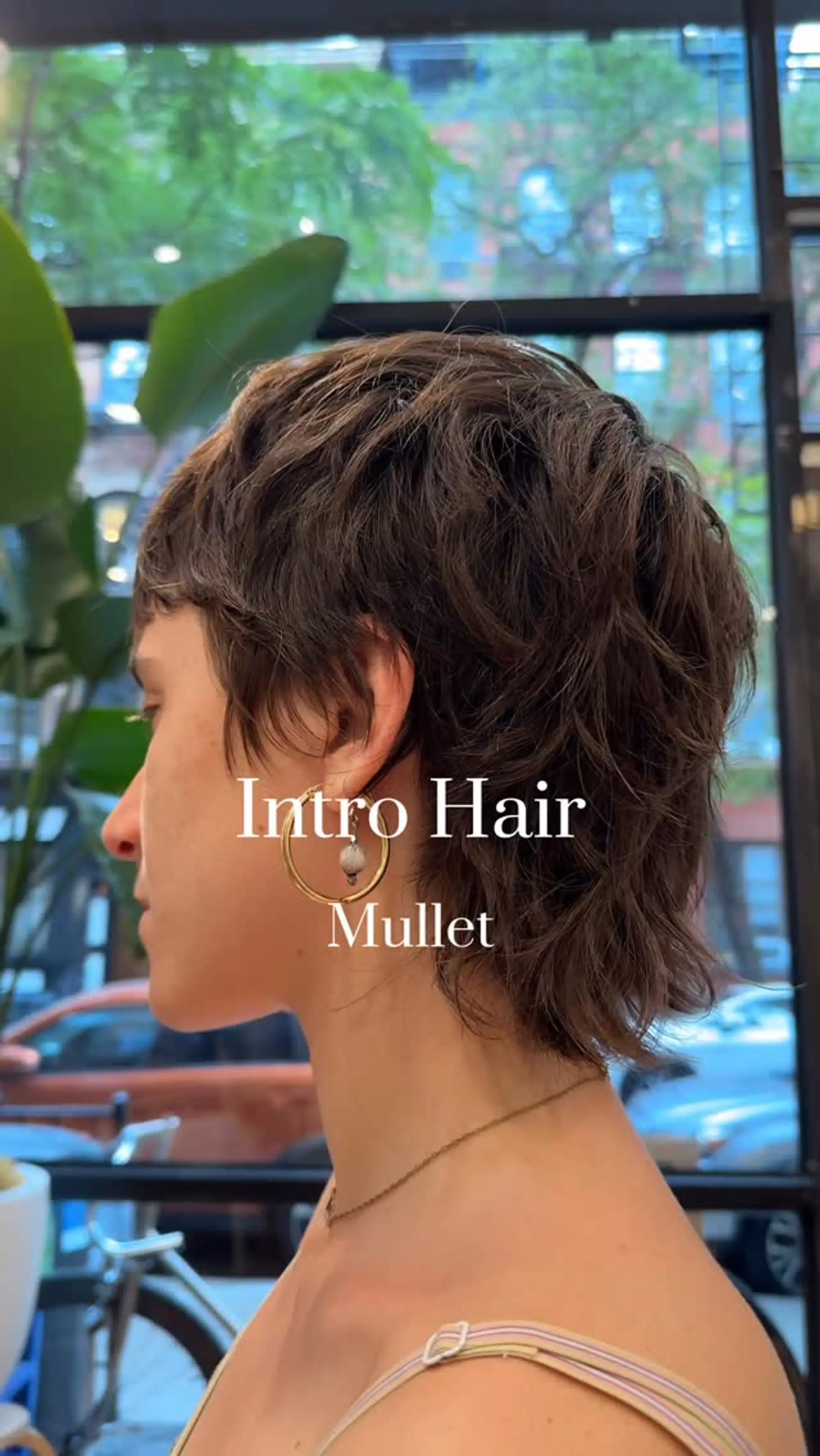 Short textured shag mullet featuring choppy, piecey layers, soft micro bangs, and nape-grazing length. 1