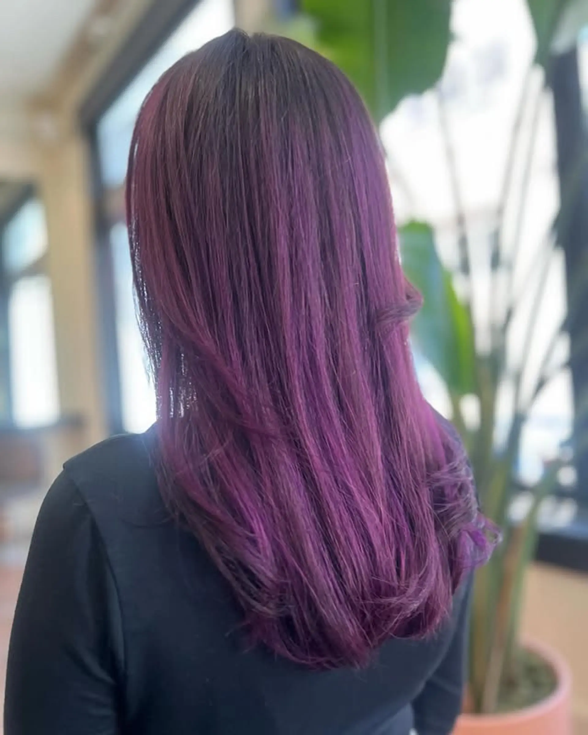 Long, straight, layered hair with a vibrant purple color melt effect. 1