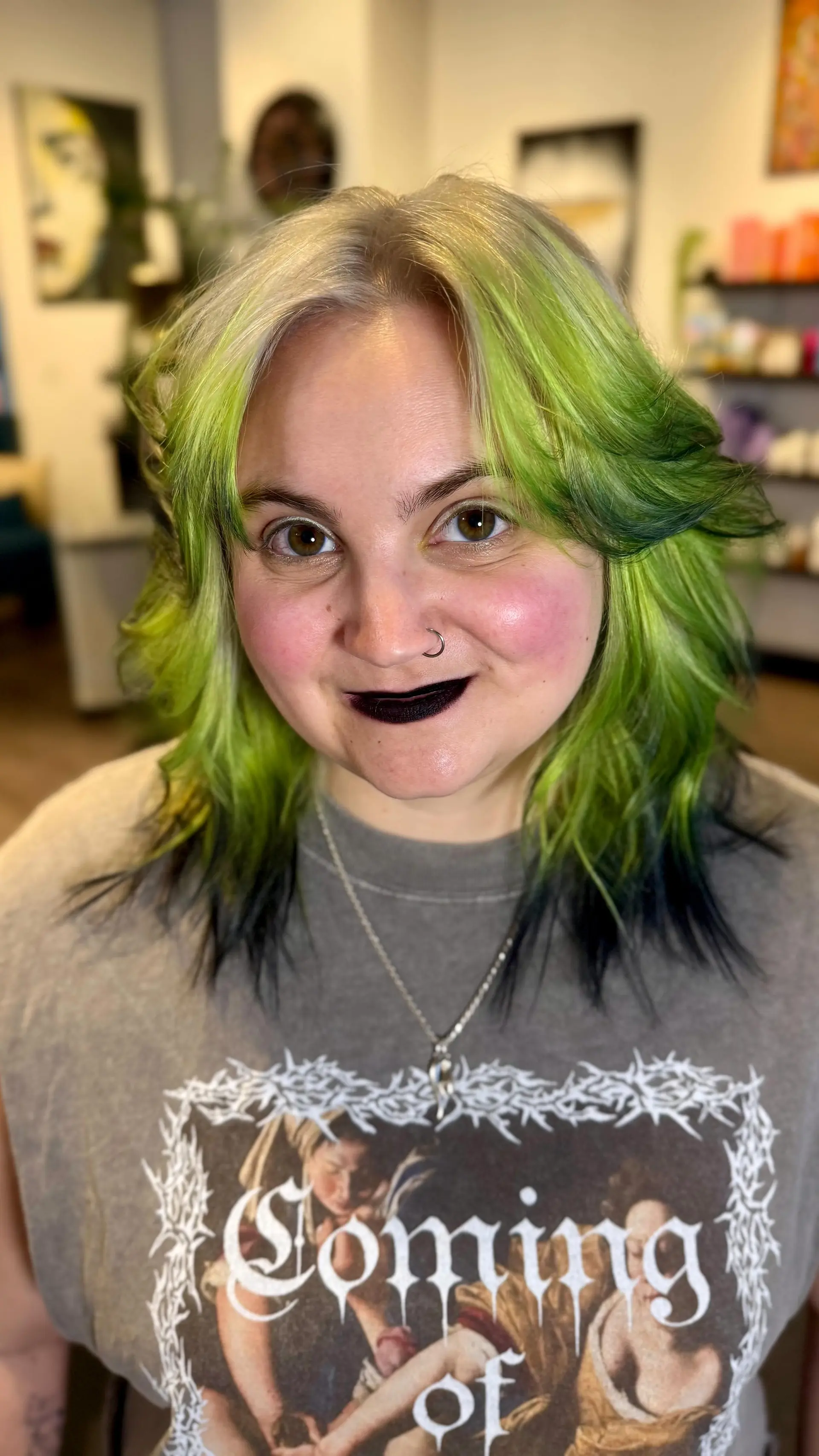 A textured medium-length shag with face-framing fringe, styled with flipped layers and colored in electric lime green fading to dark ends. 1