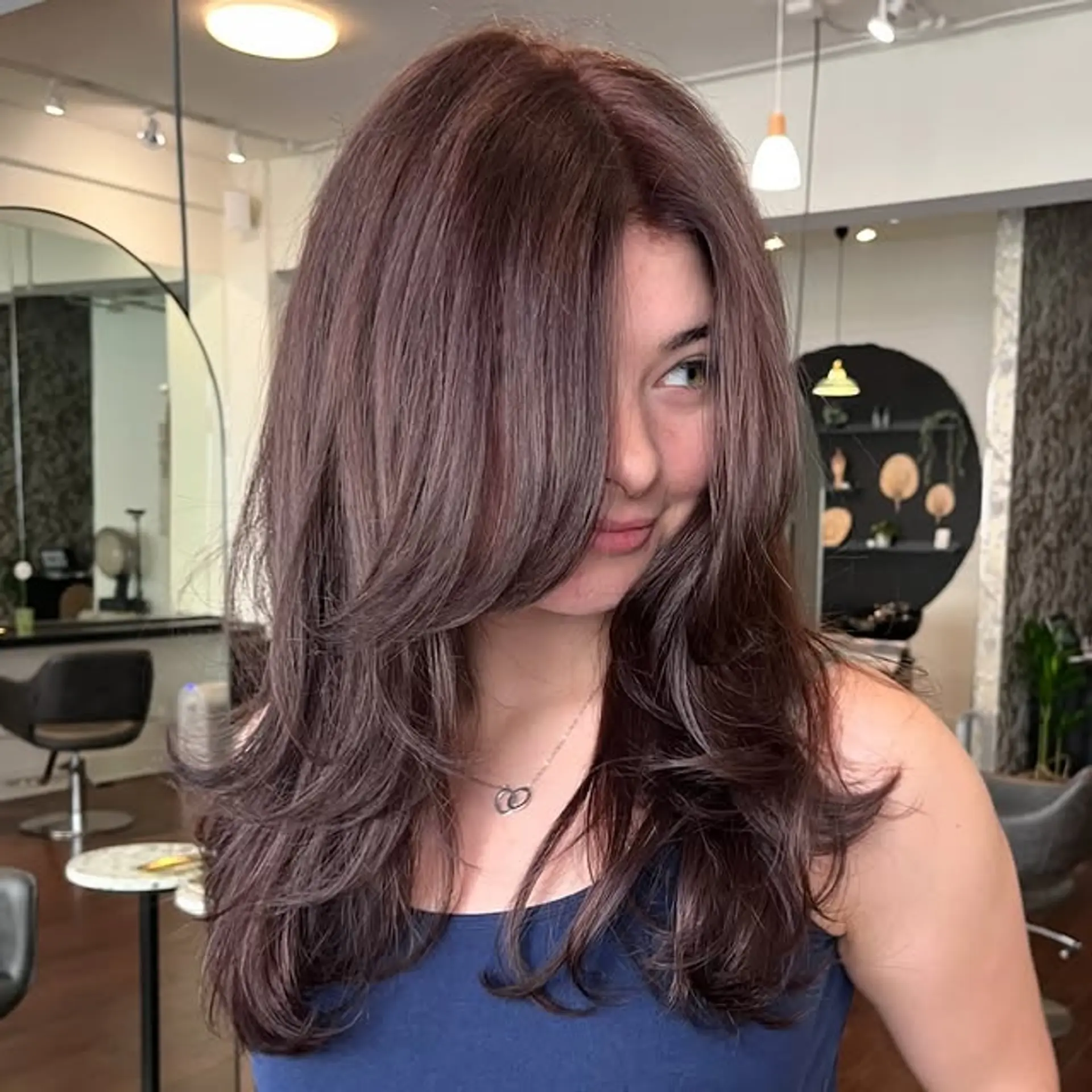 Long layered hair with face-framing layers that enhance movement and create a flattering shape. 1