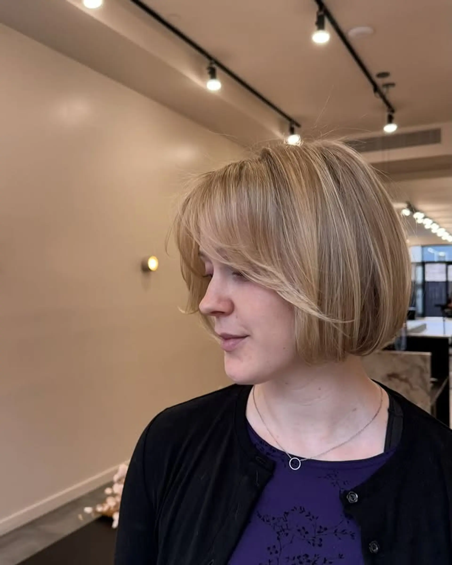 A classic blunt bob with subtle face-framing layers for a soft and modern look. 1