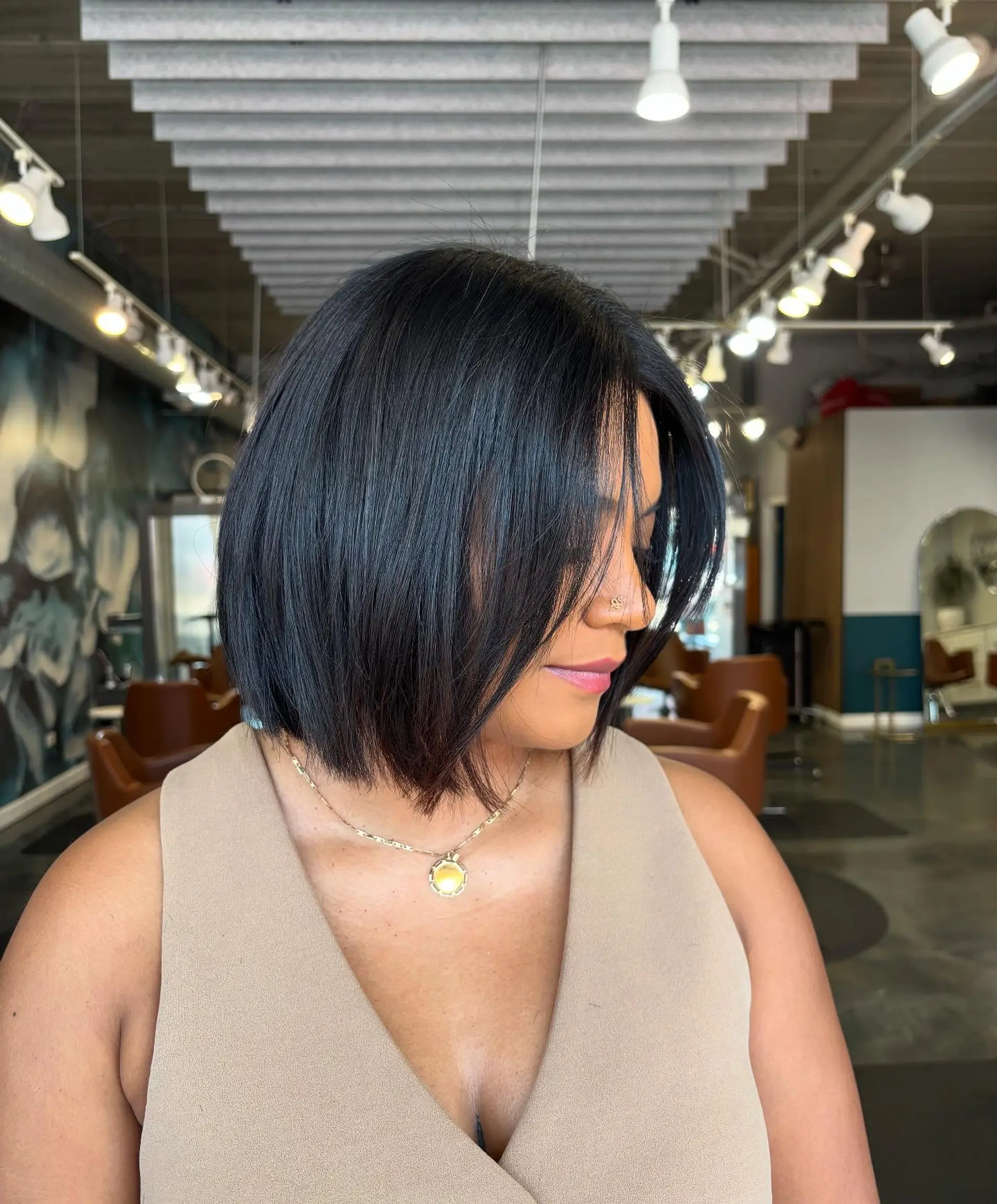 A sleek, chin-length bob with straight hair. 1