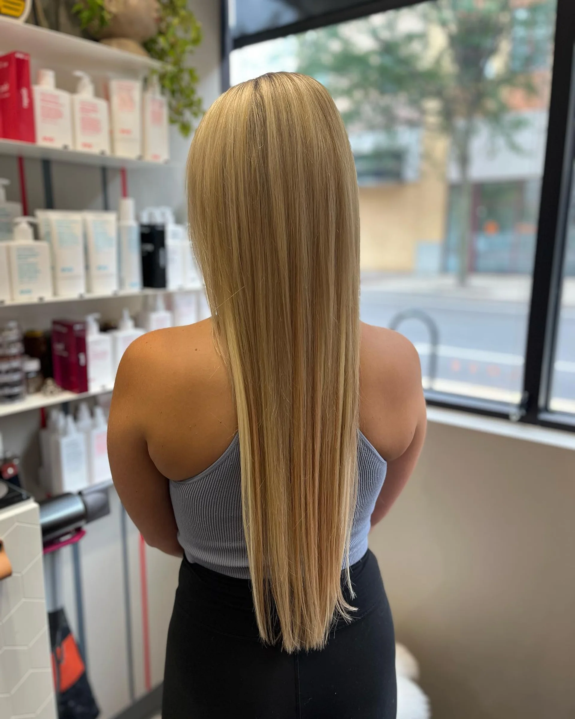 Woman showcasing a stylish protective loc ponytail, ideal for winter hair protection. - Preview 1