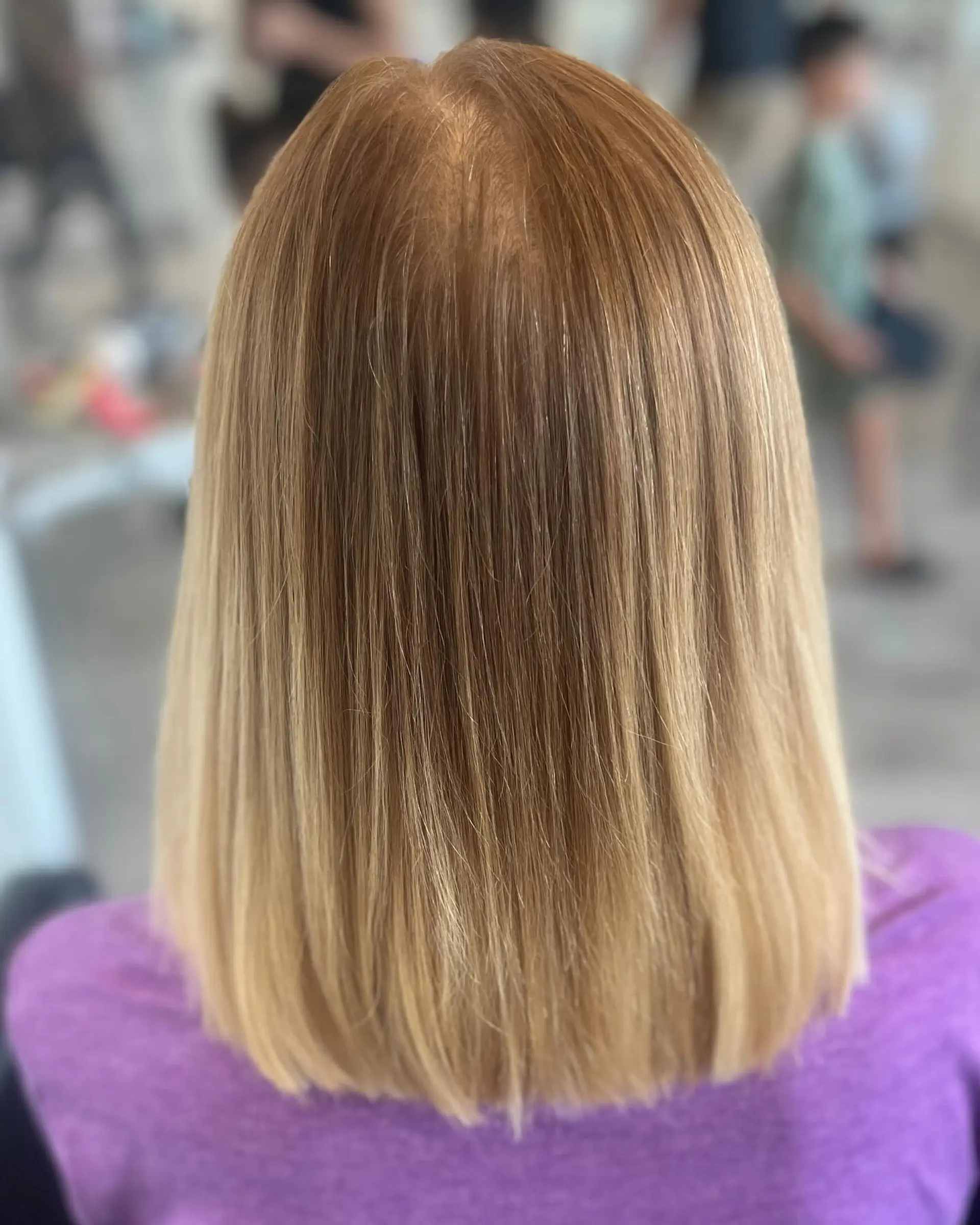 A sleek, straight, medium-length bob with face-framing highlights. 2