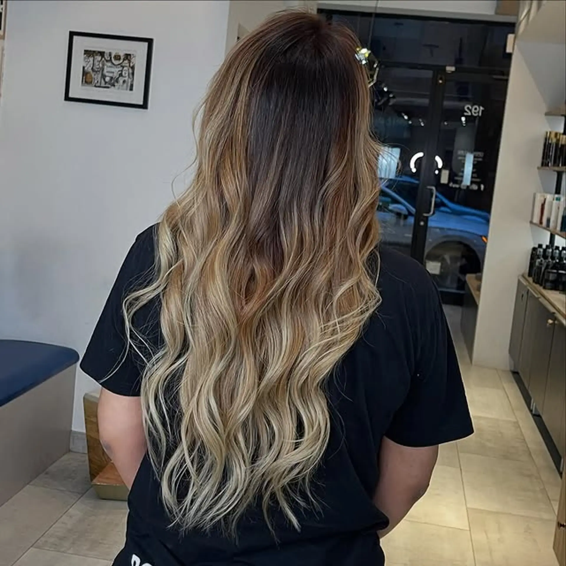 A beautiful long hair with bronde balayage styled into beachy waves. 1