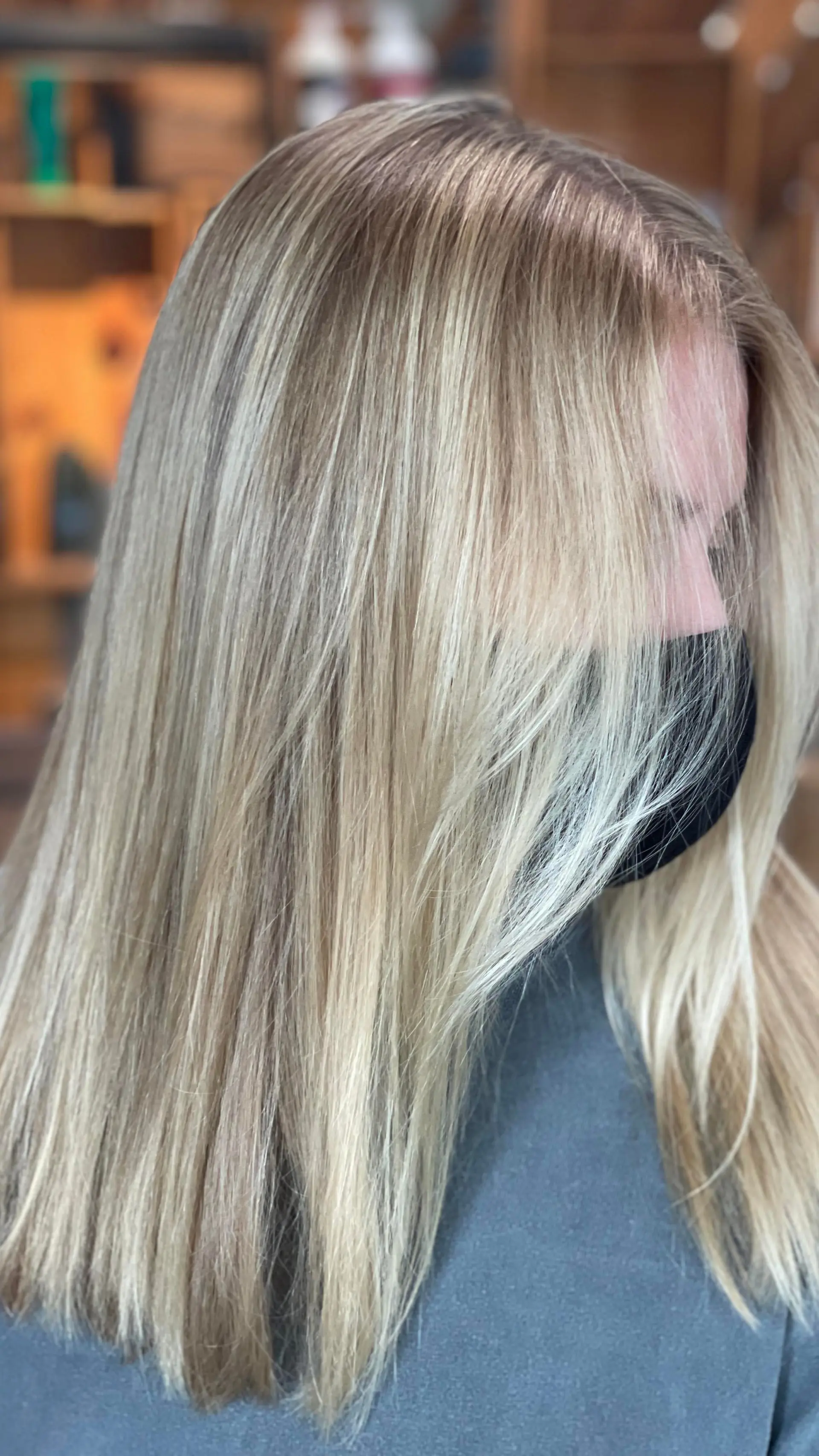 Medium-length straight hair featuring fine dimensional blonde balayage highlights with soft face framing. 1