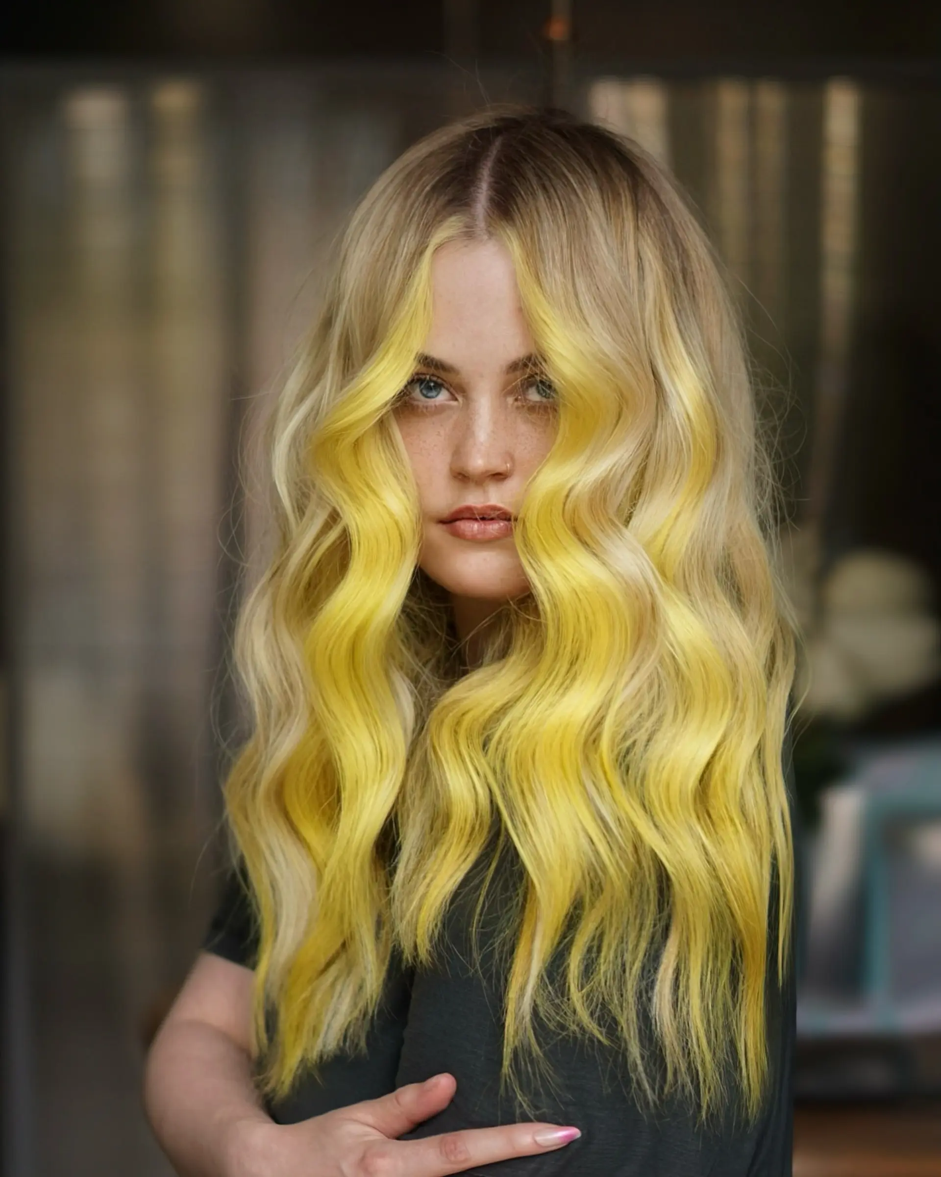 Long wavy blonde hair highlighted with bright lemon-yellow face-framing money pieces. 1