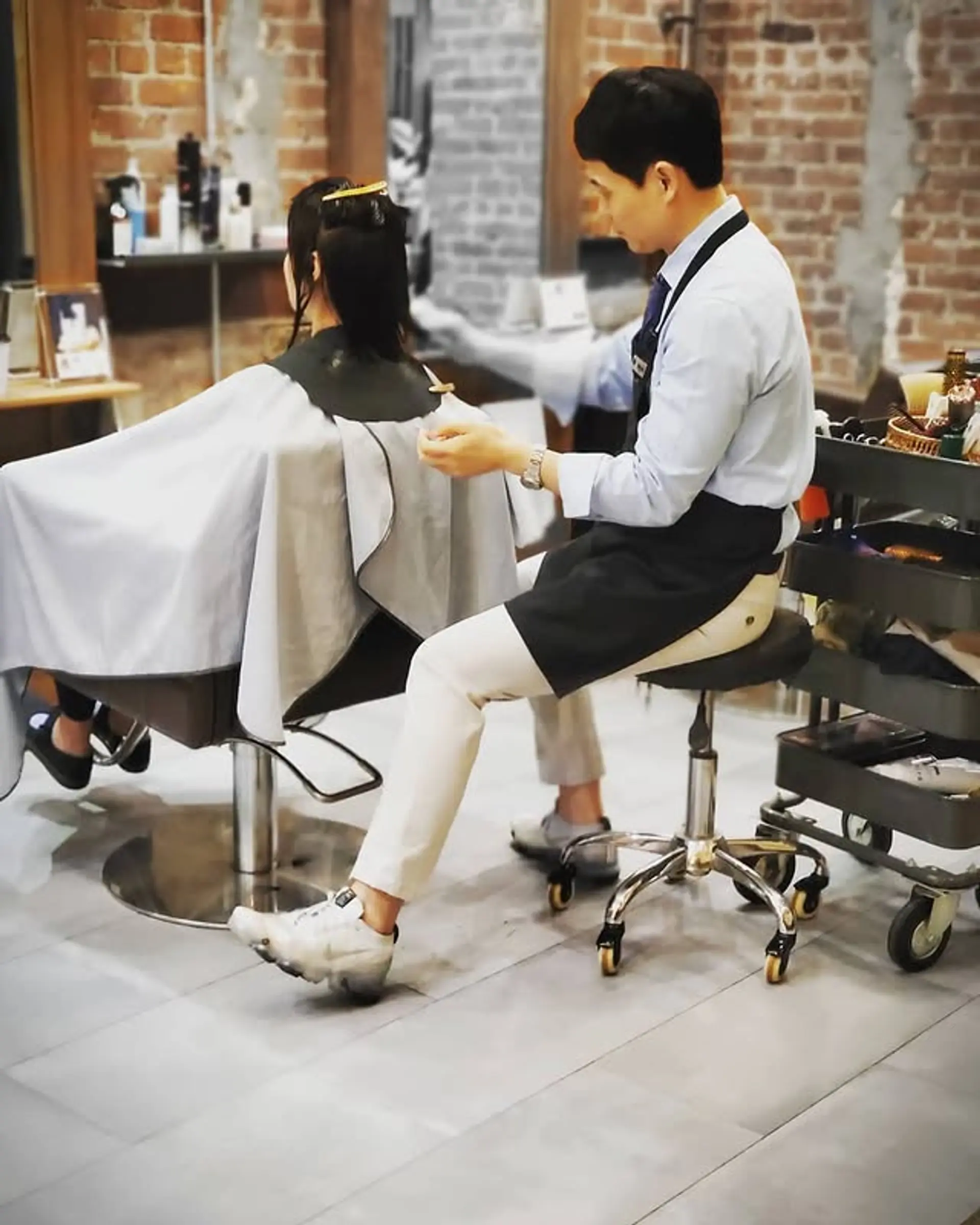 A sleek and layered long hairstyle, professionally cut. 1