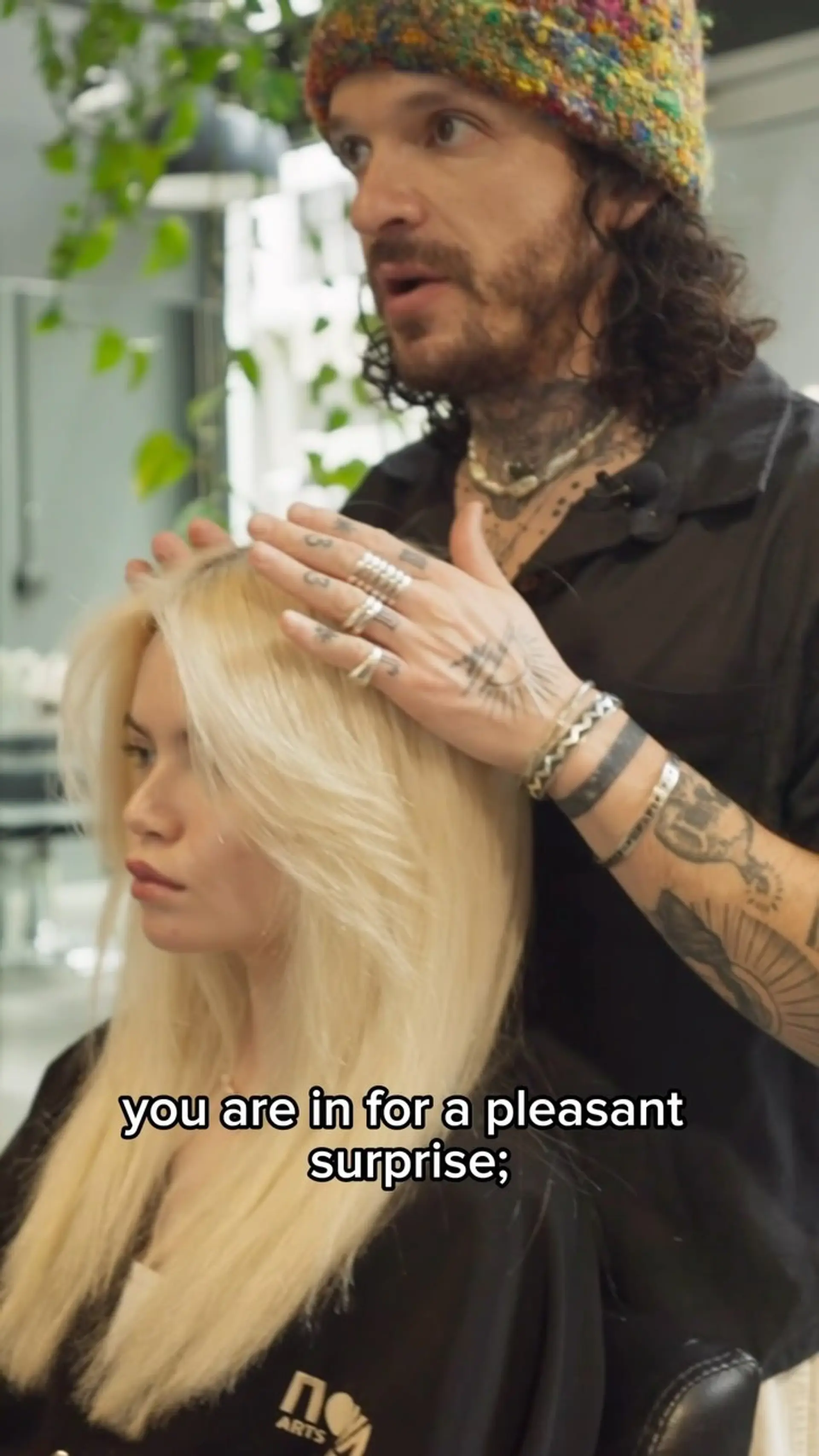 Long platinum blonde hair styled with feathered face-framing layers and soft volume. 1