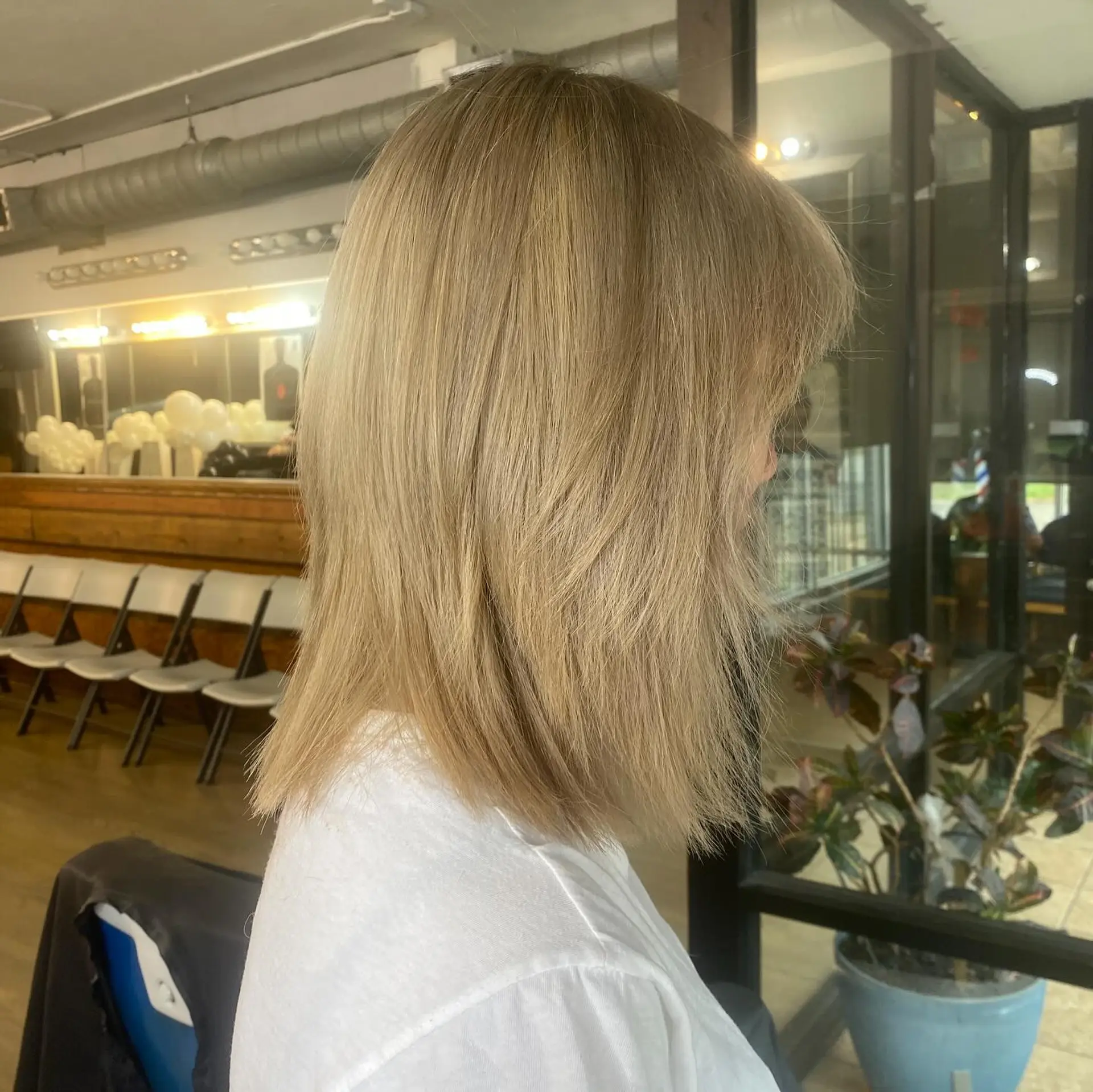 A shaggy lob with curtain bangs and lots of texture. 1