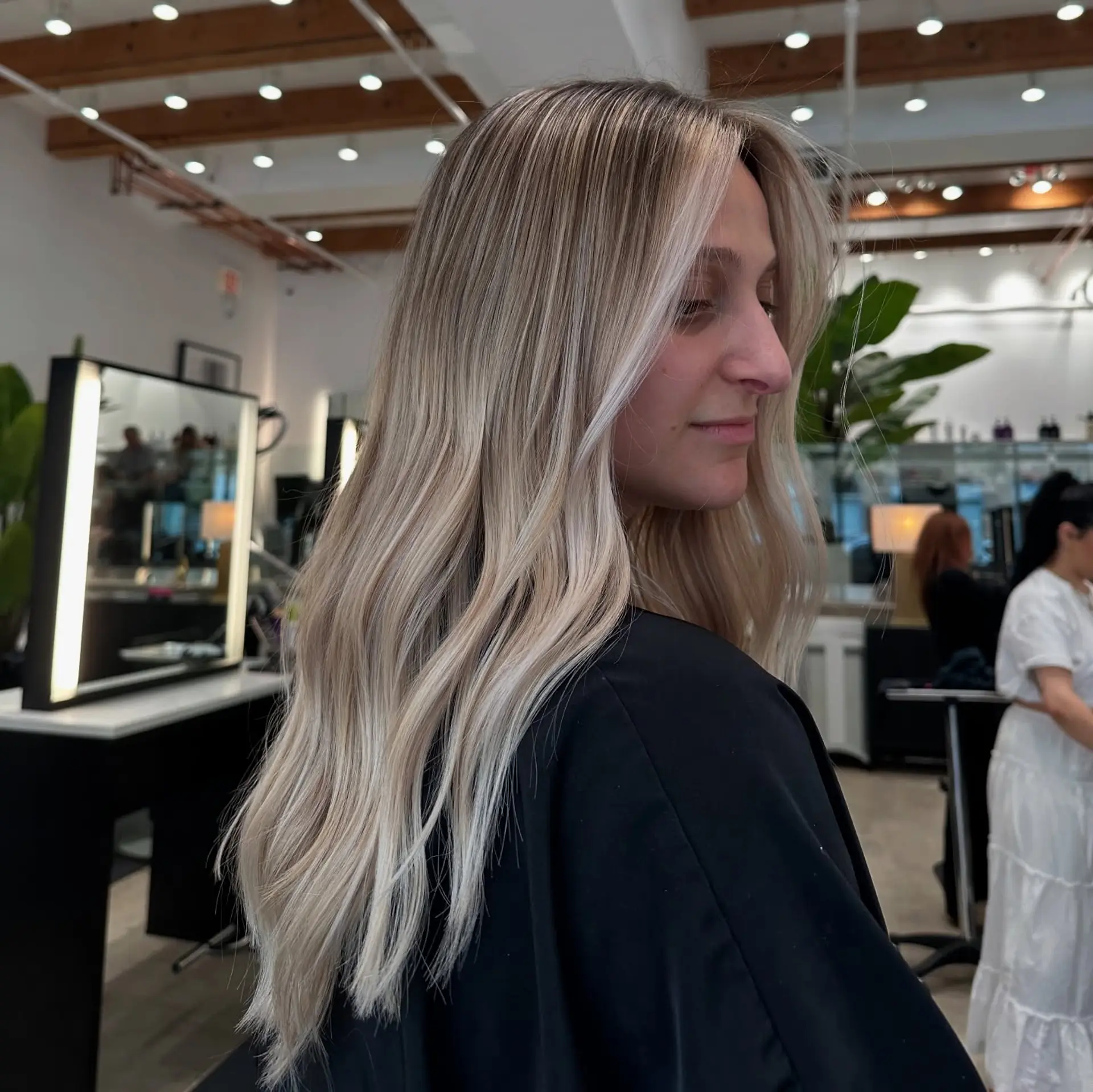 Long, wavy hair with an icy blonde balayage. 1
