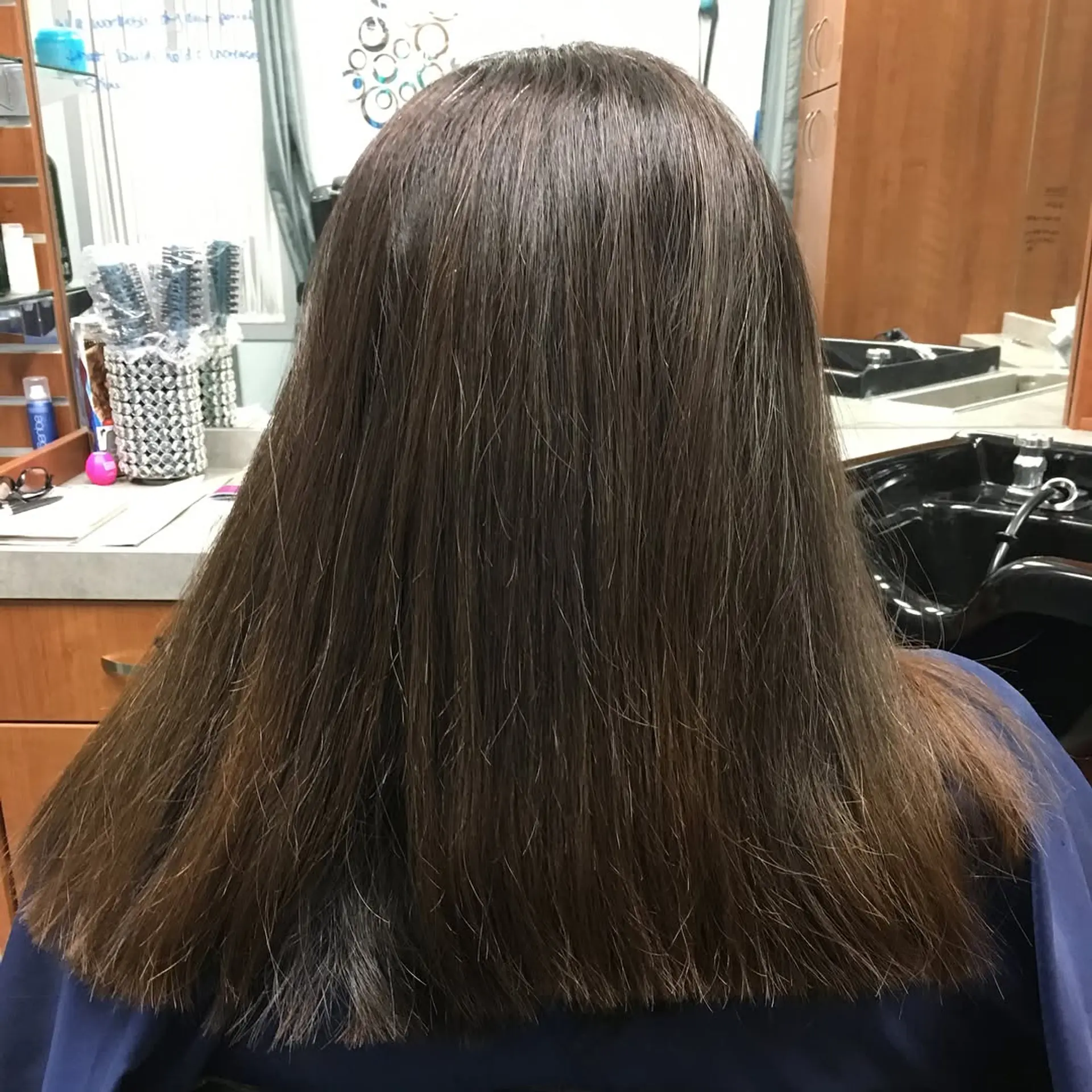 Straight brunette hair cut into a clean, even blunt perimeter. 1