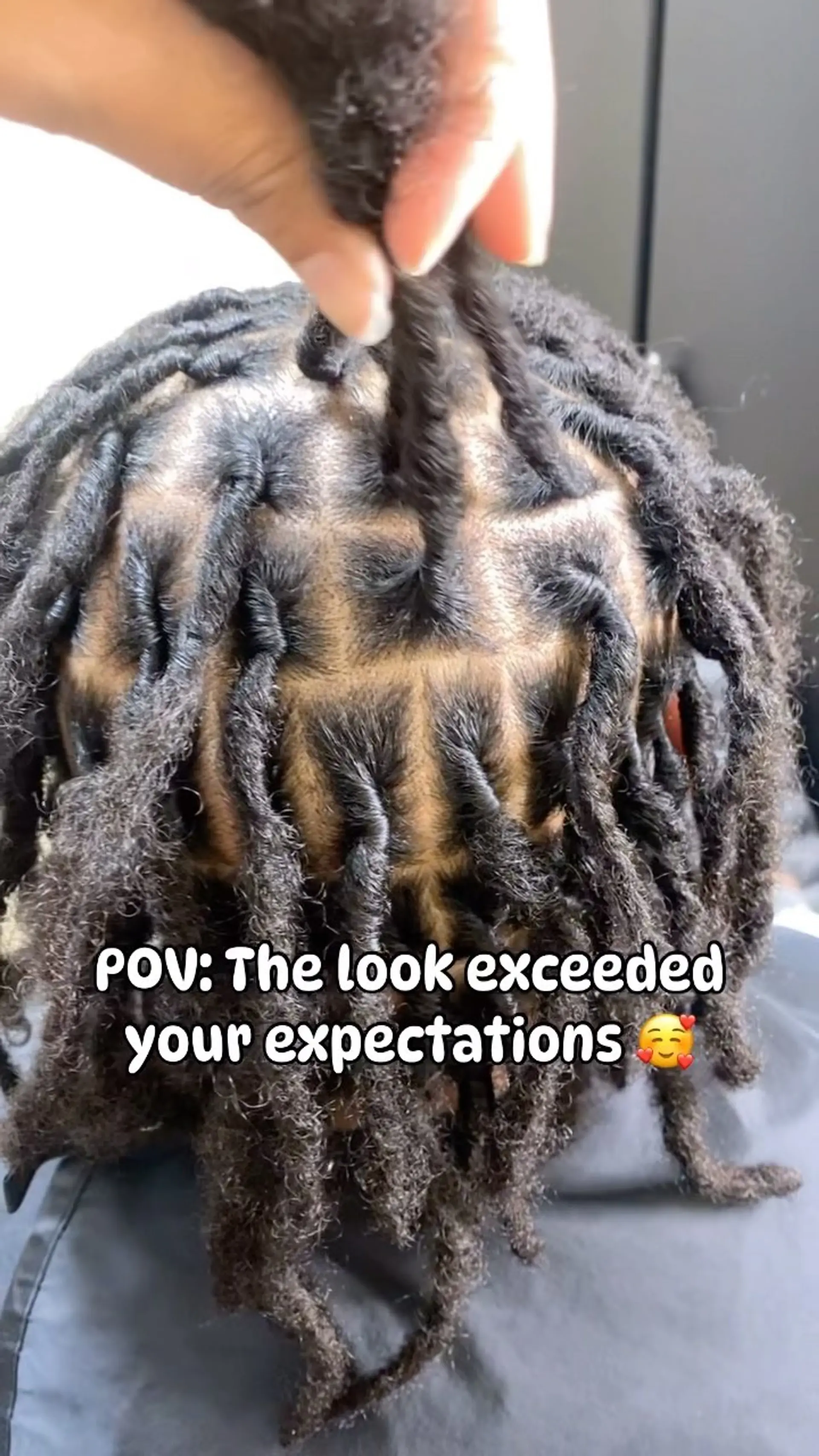 A fresh loc retwist featuring neat, precise square parting across the scalp. 1