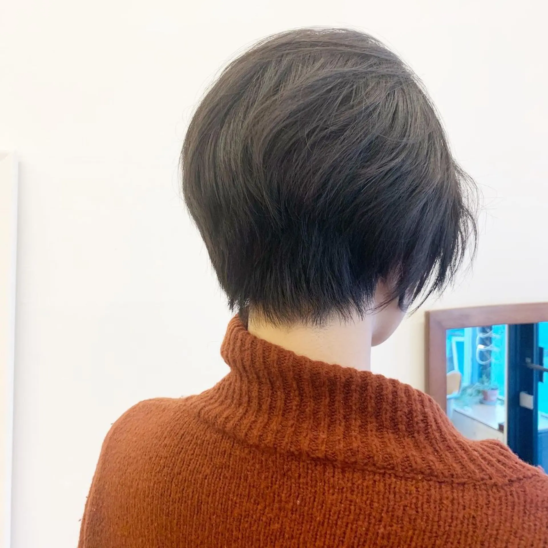 Sleek bob cut, ear-length, side-parted, minimal layers, straight black hair with natural shine by Takeo. 2