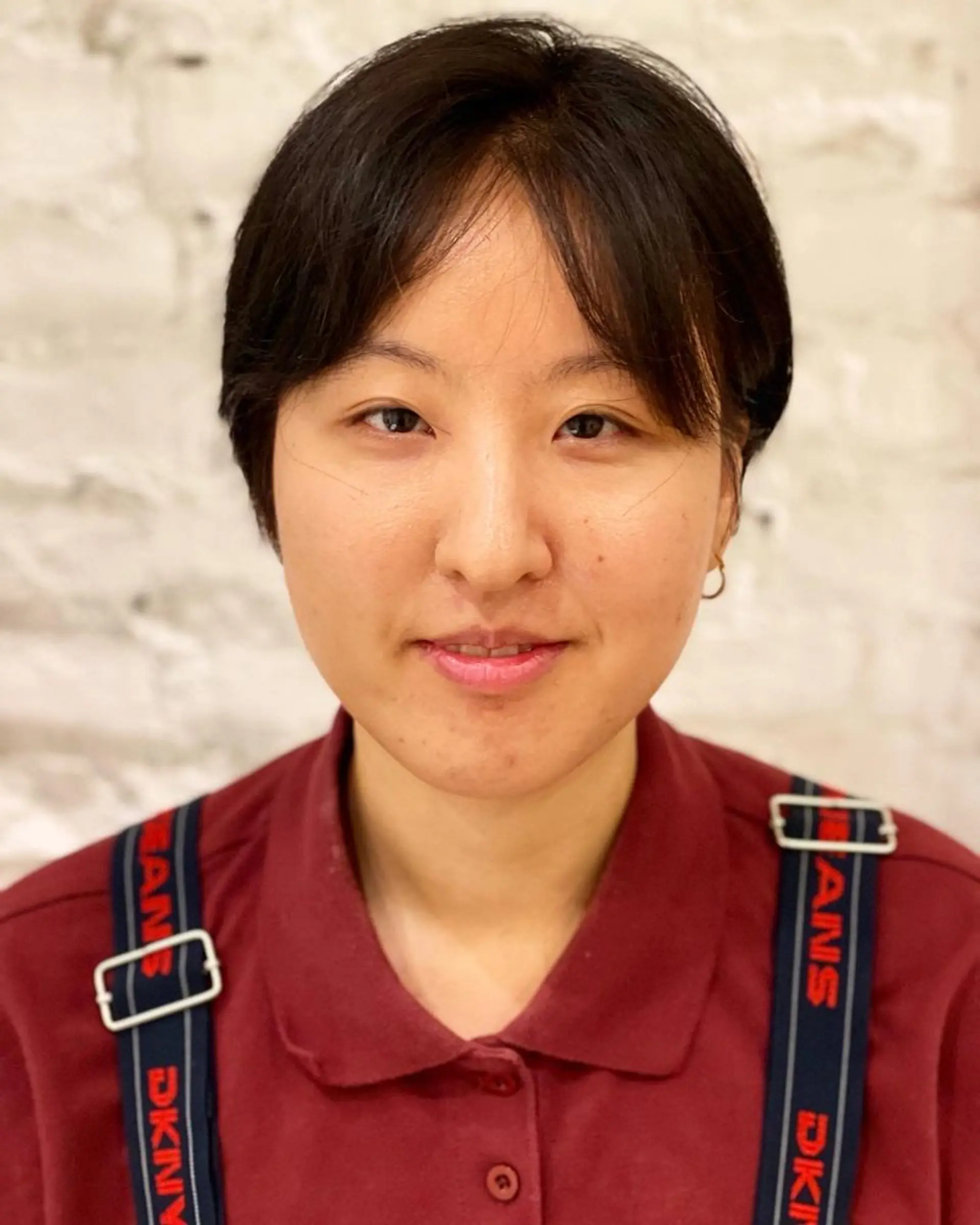 A chic and edgy short haircut with a modern bowl shape. 1