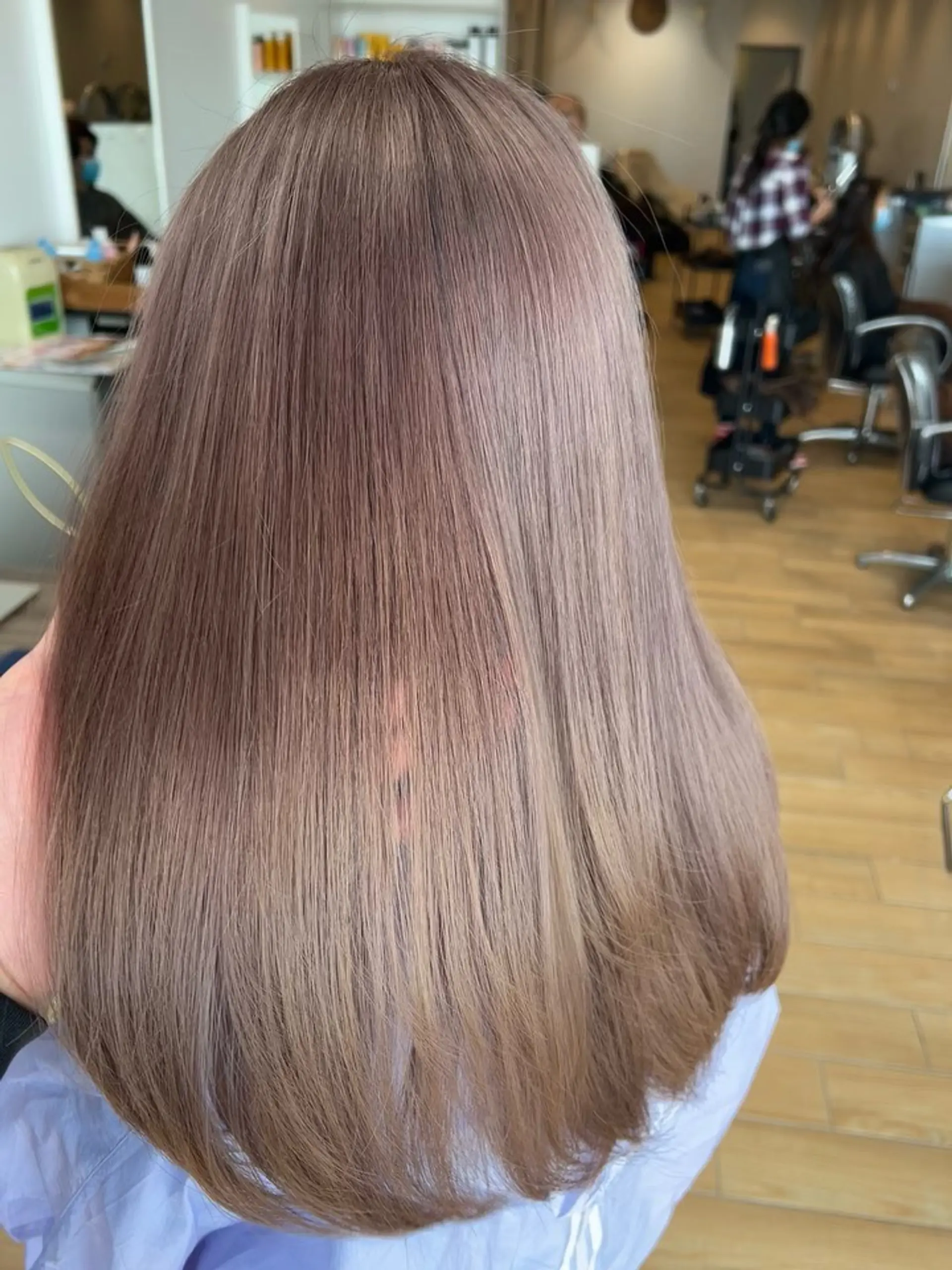 Glossy, sleek straight long hair dyed in a cool-toned ash beige shade. 1