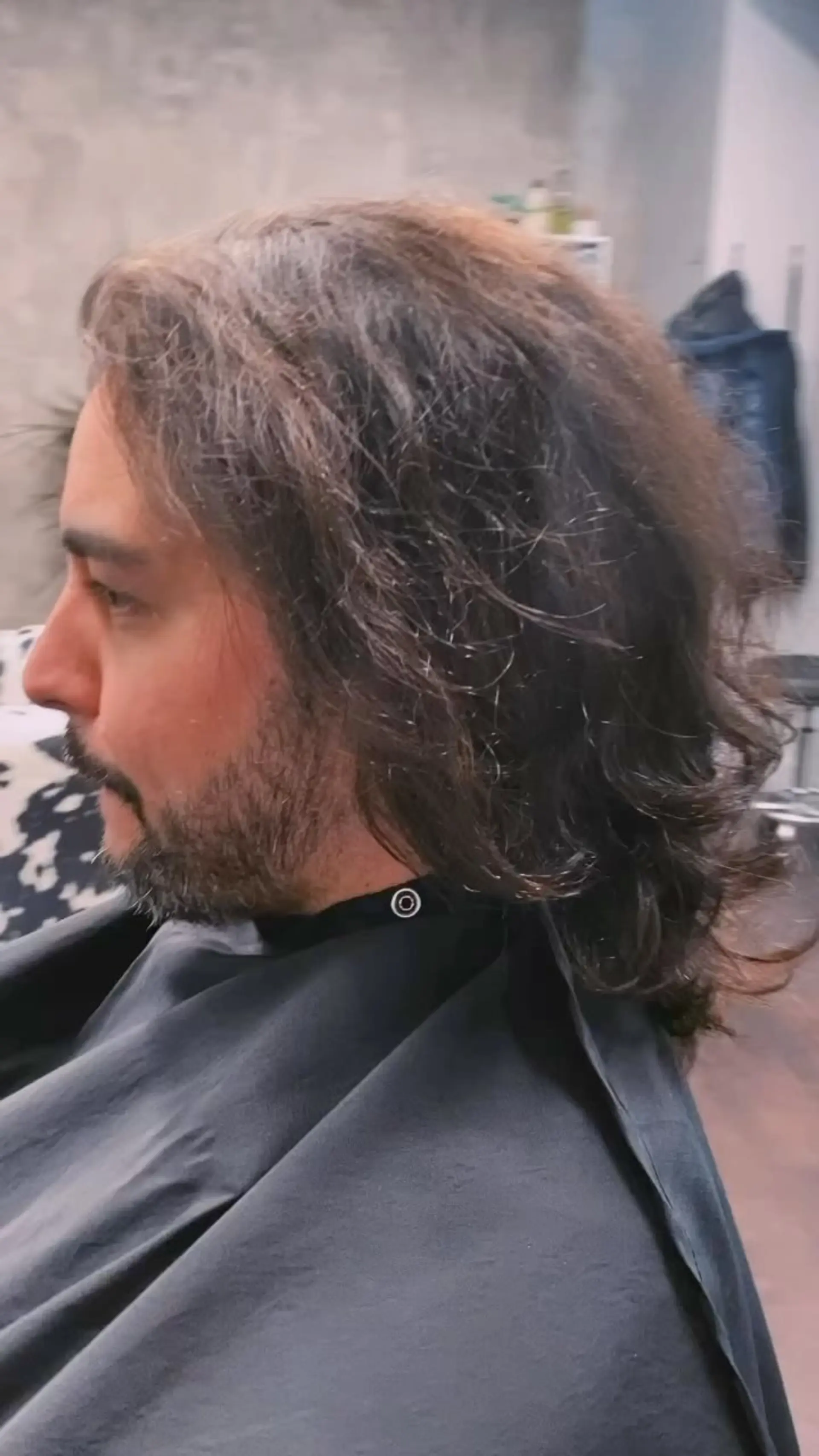 A medium-length layered cut with natural waves, balanced to grow out evenly. 1
