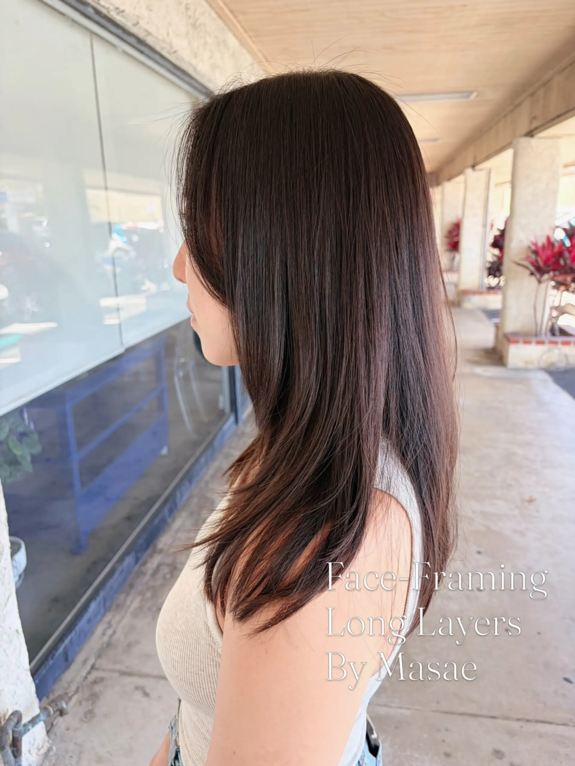 Long, glossy dark brown hair styled straight with gentle face-framing layers. 1