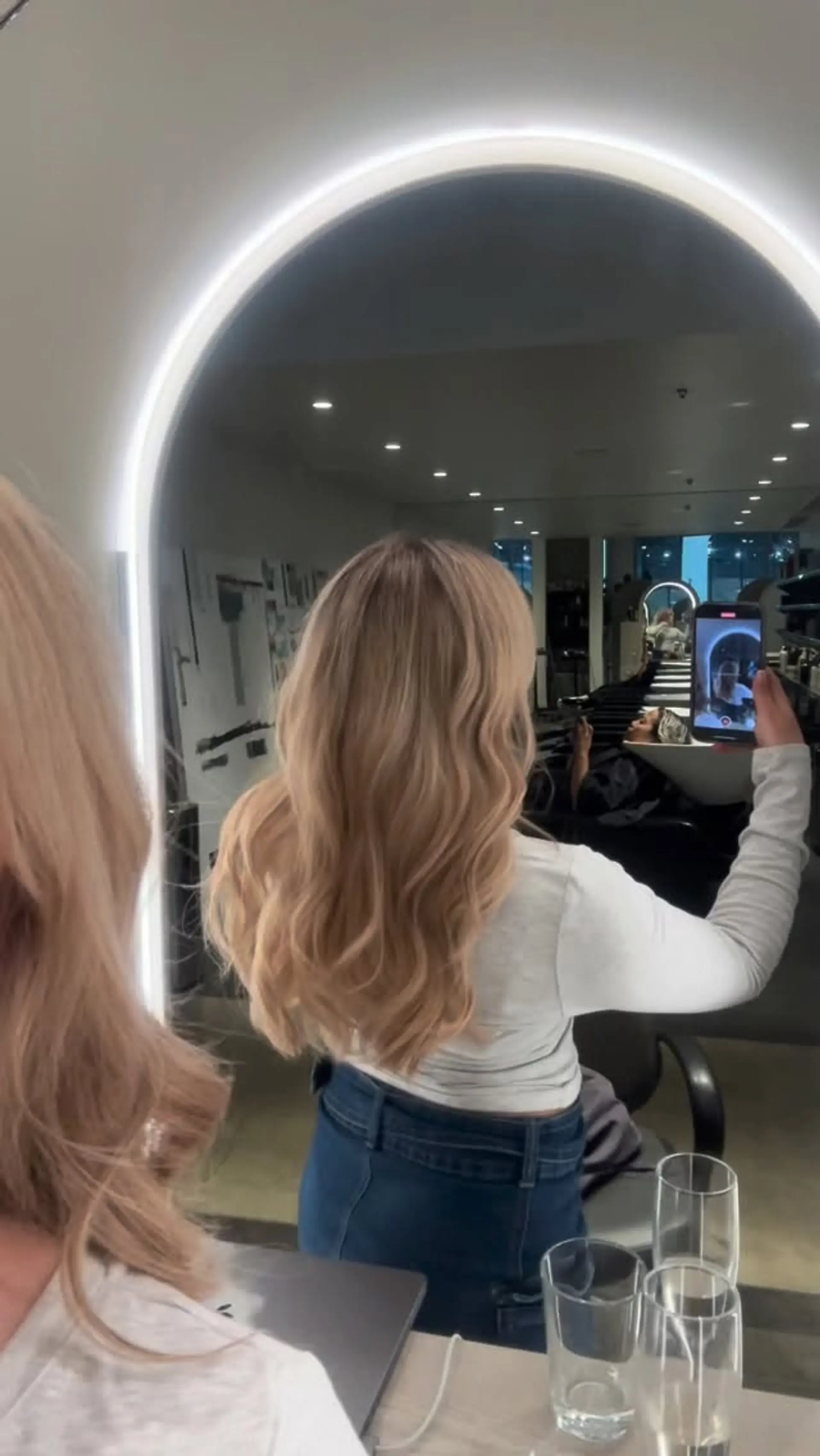 Long dimensional blonde hair styled in soft, cascading blowout waves. 1