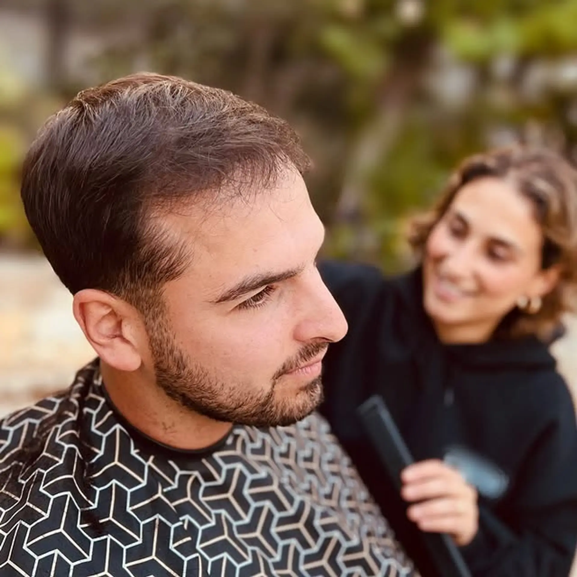 A short, clean-cut taper fade. 1