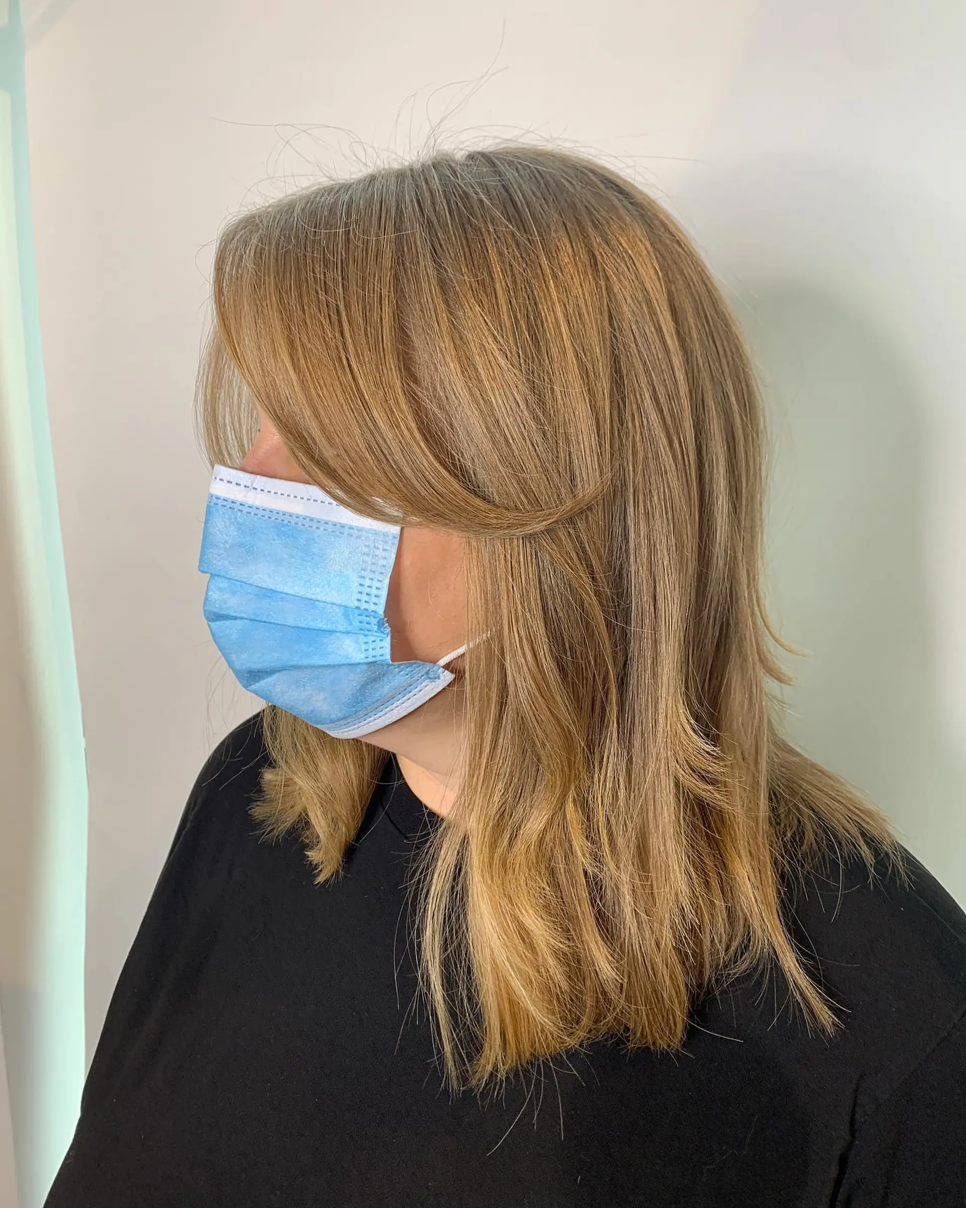 A layered shag haircut with face-framing layers and feathered bangs. 1