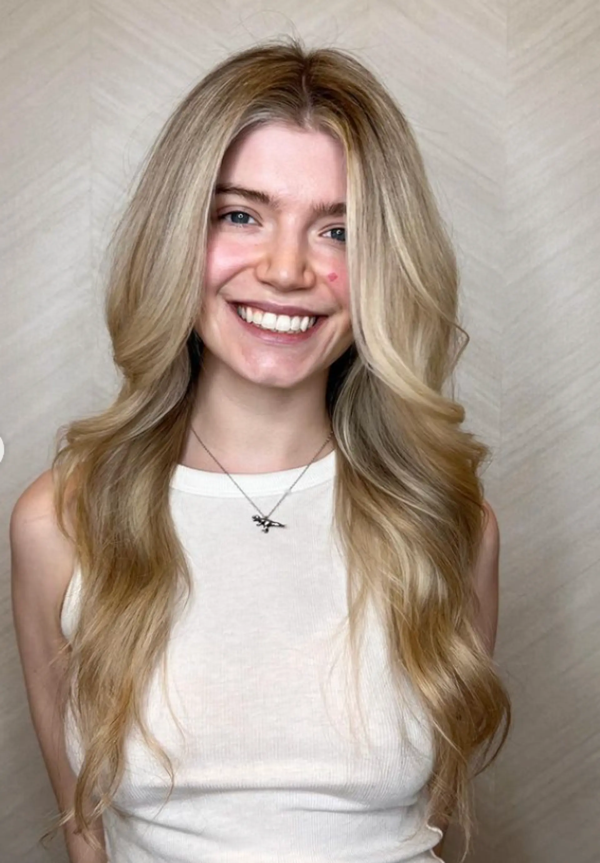 Very long, wavy blonde hair with golden highlights, soft waves, and loose curls forming a face-framing style.

 2