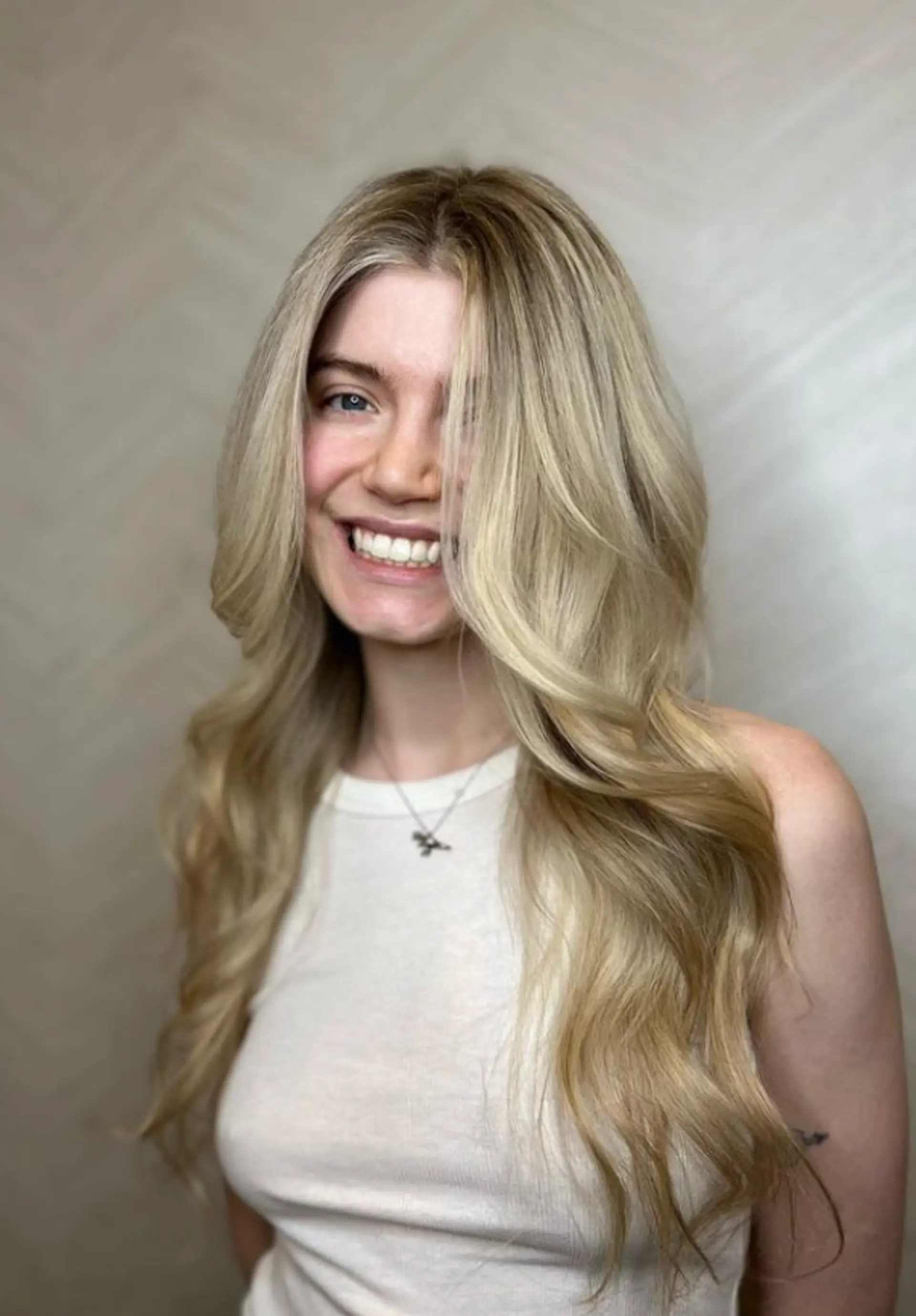 Very long, wavy blonde hair with golden highlights, soft waves, and loose curls forming a face-framing style.

 3