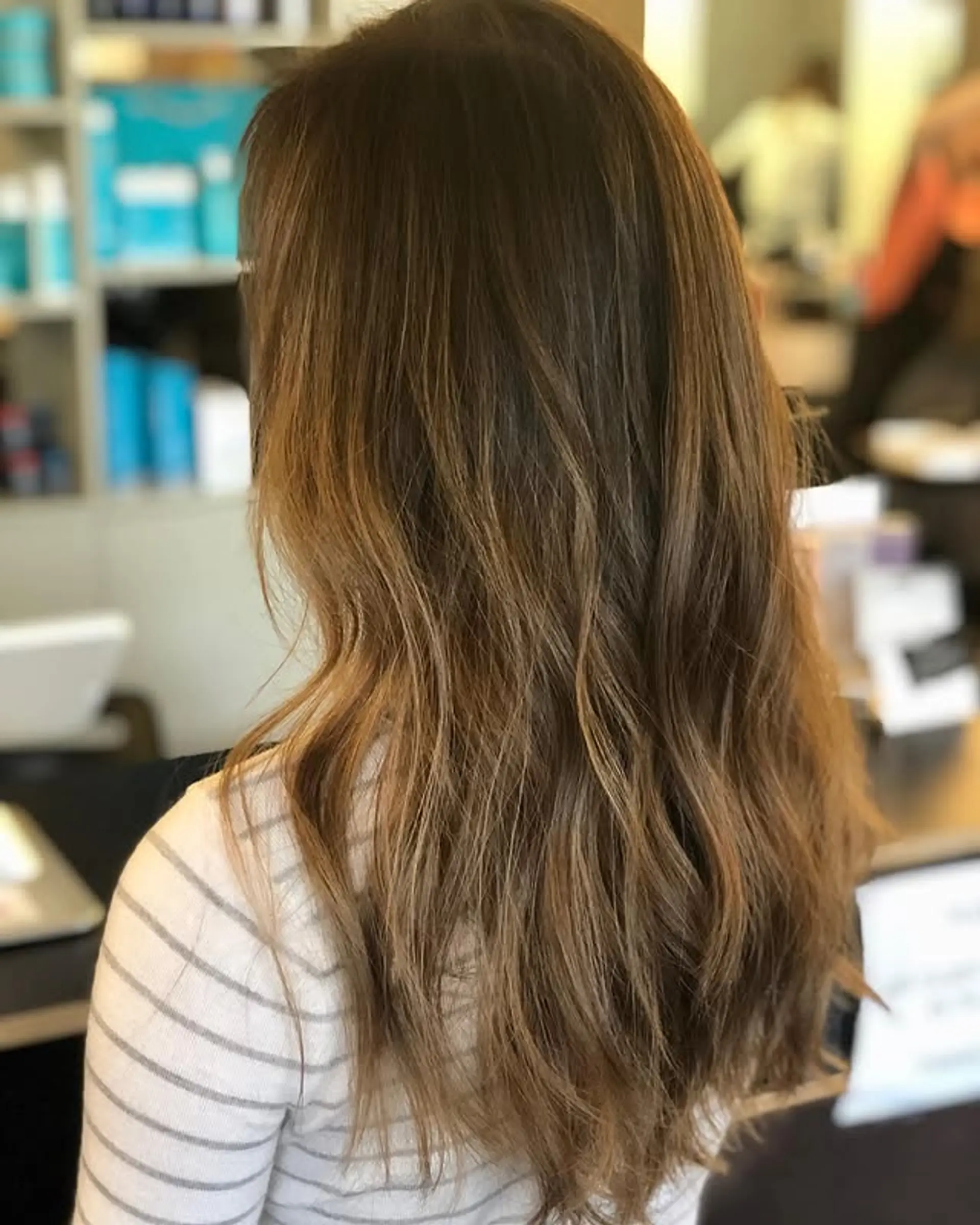 Long, wavy hair with a subtle balayage. 1