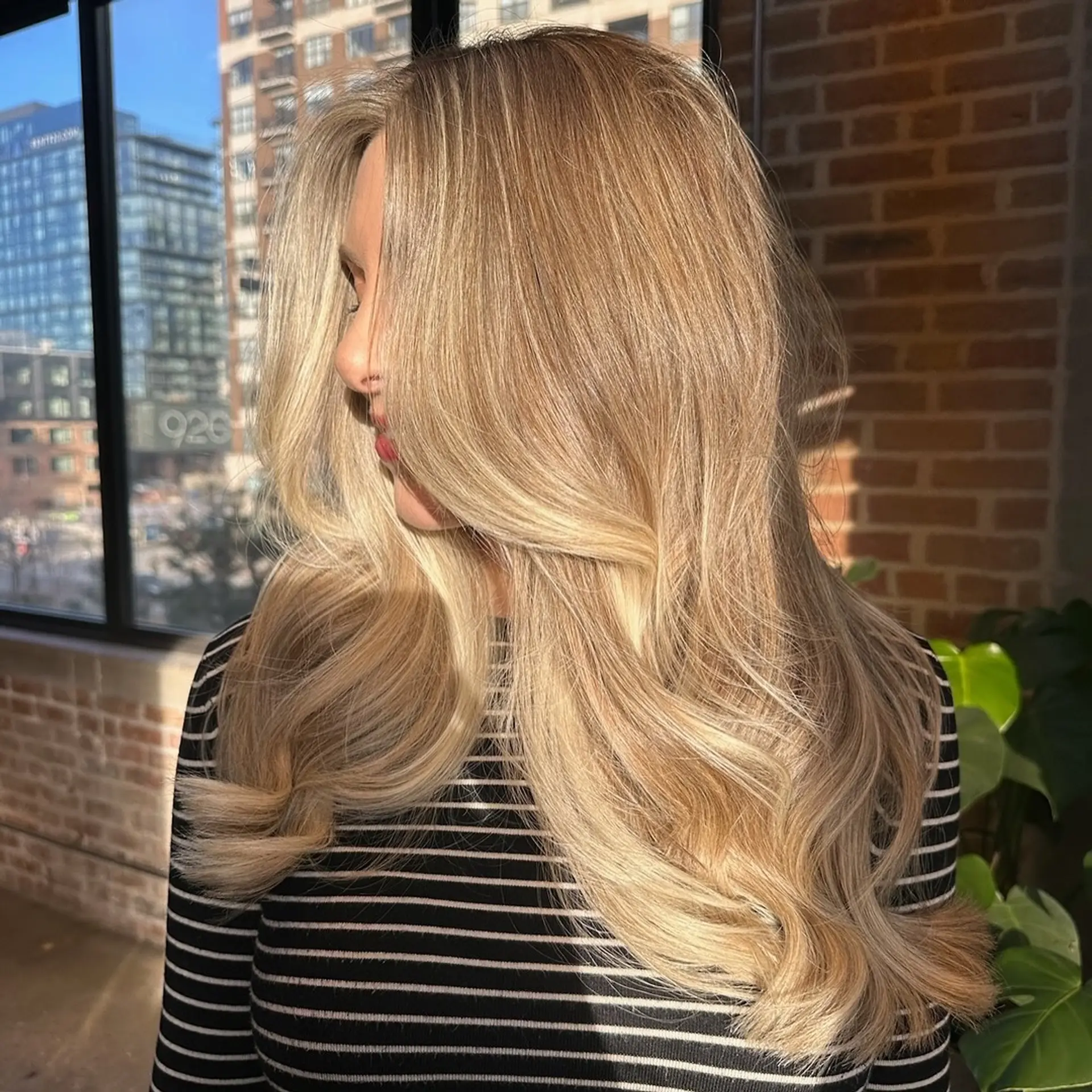 Long, wavy hairstyle with blonde balayage and subtle layers. 1