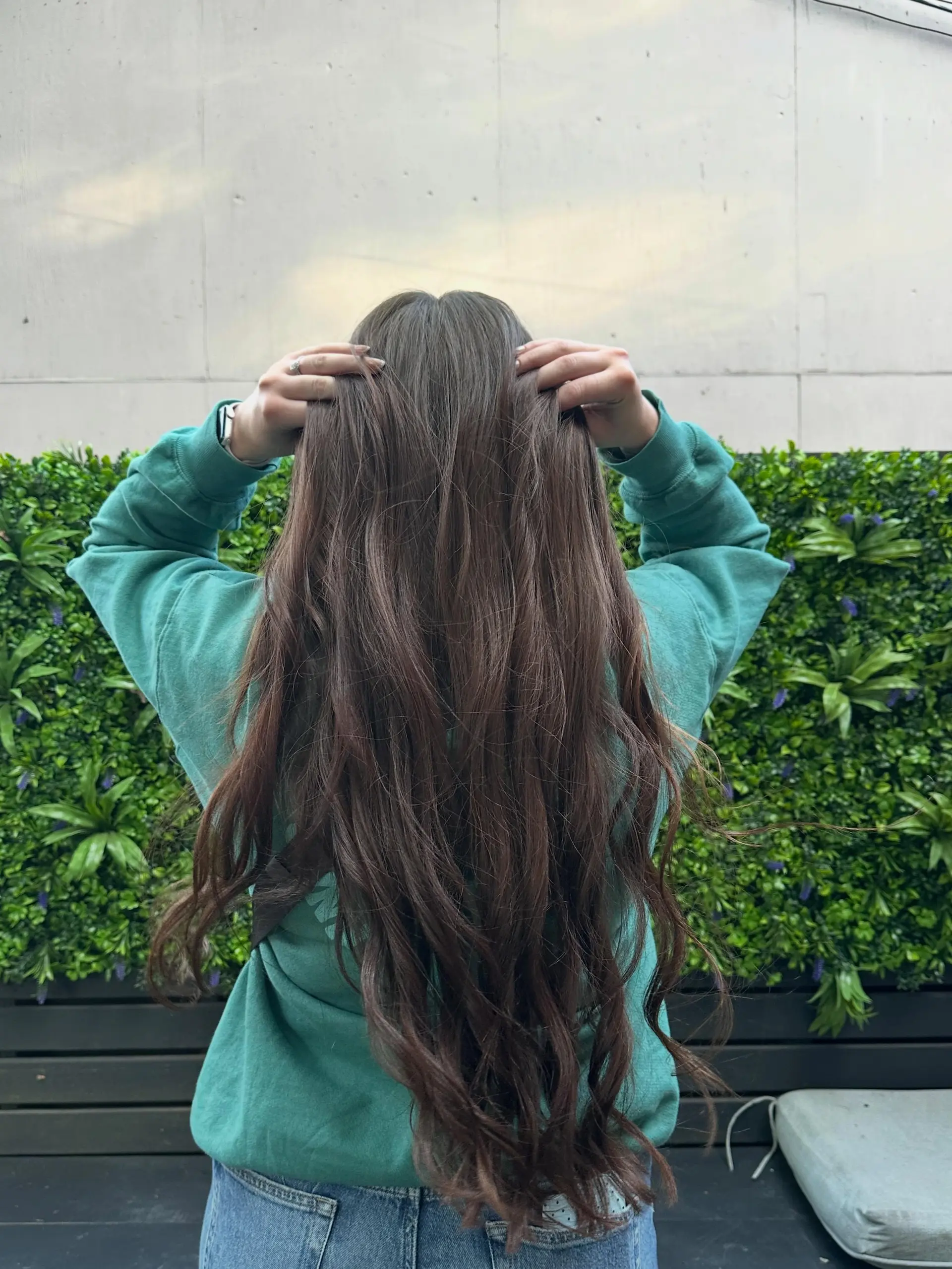 Extra-long rich brunette hair styled with loose, flowing waves. 1