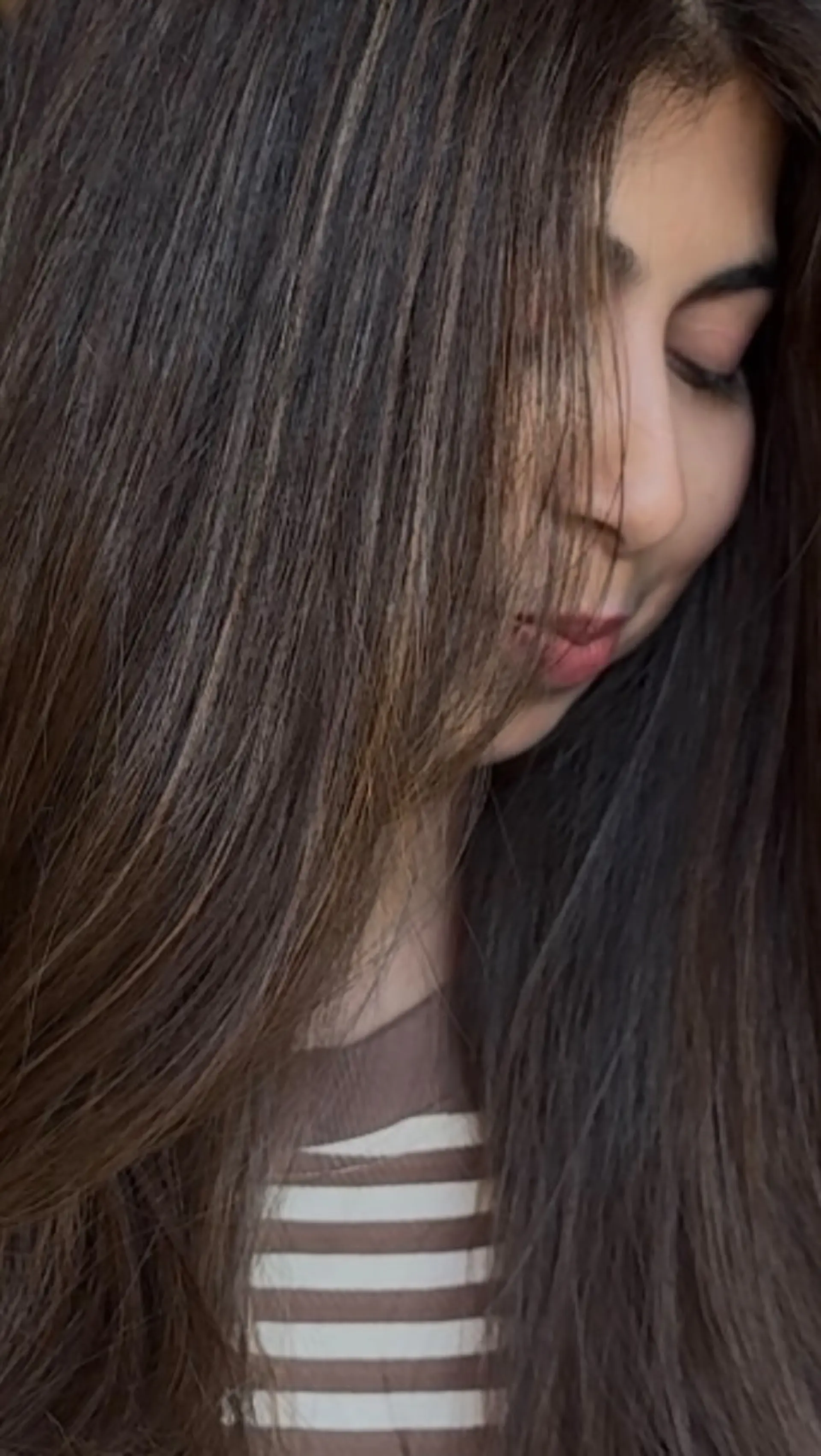 Long, smooth straight dark hair accented with delicate, fine babylights for natural grey blending and seamless dimension. 1