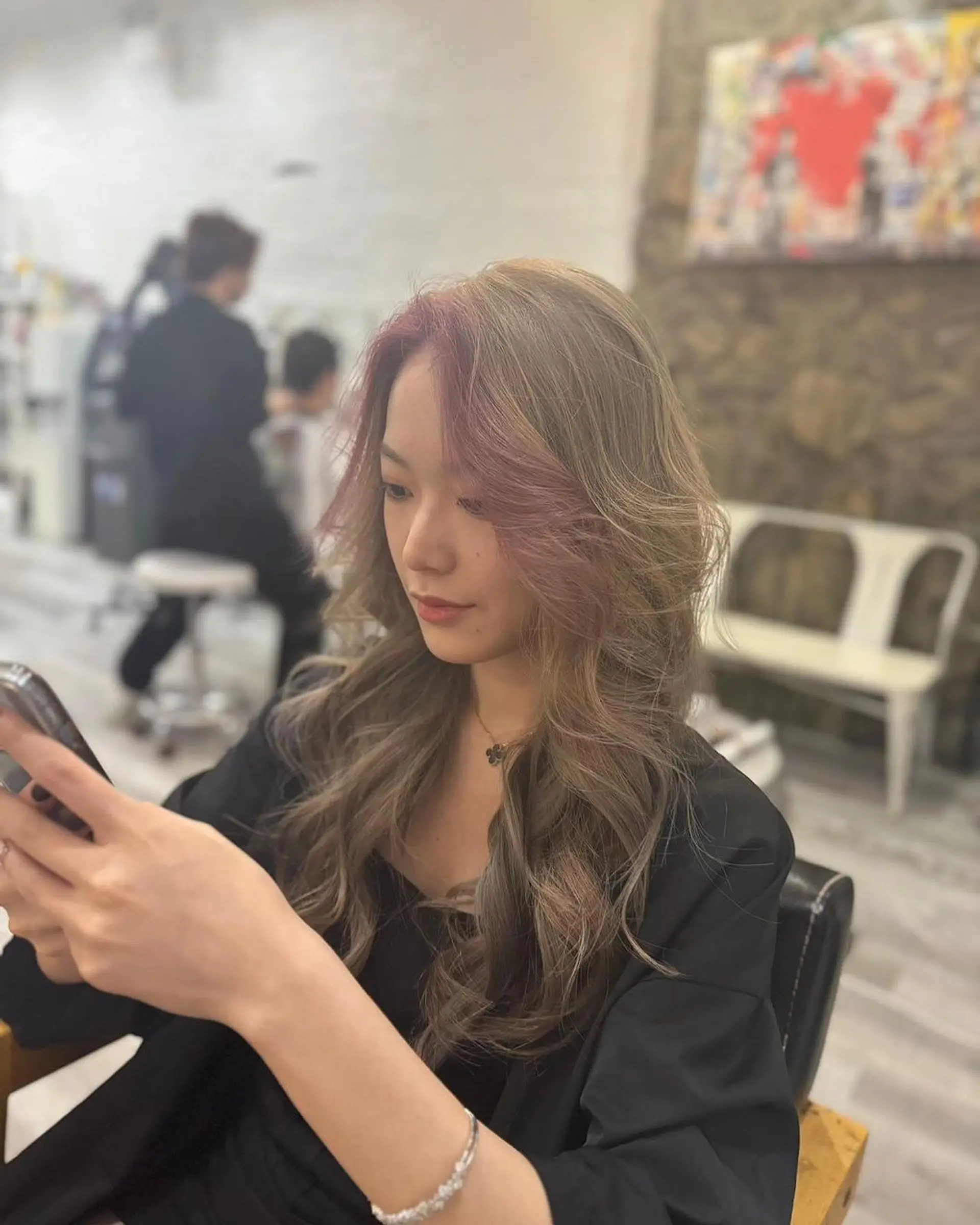 Long, wavy hair with light brown base color, blonde ombre, and pink highlights, styled in layers for added volume. 1