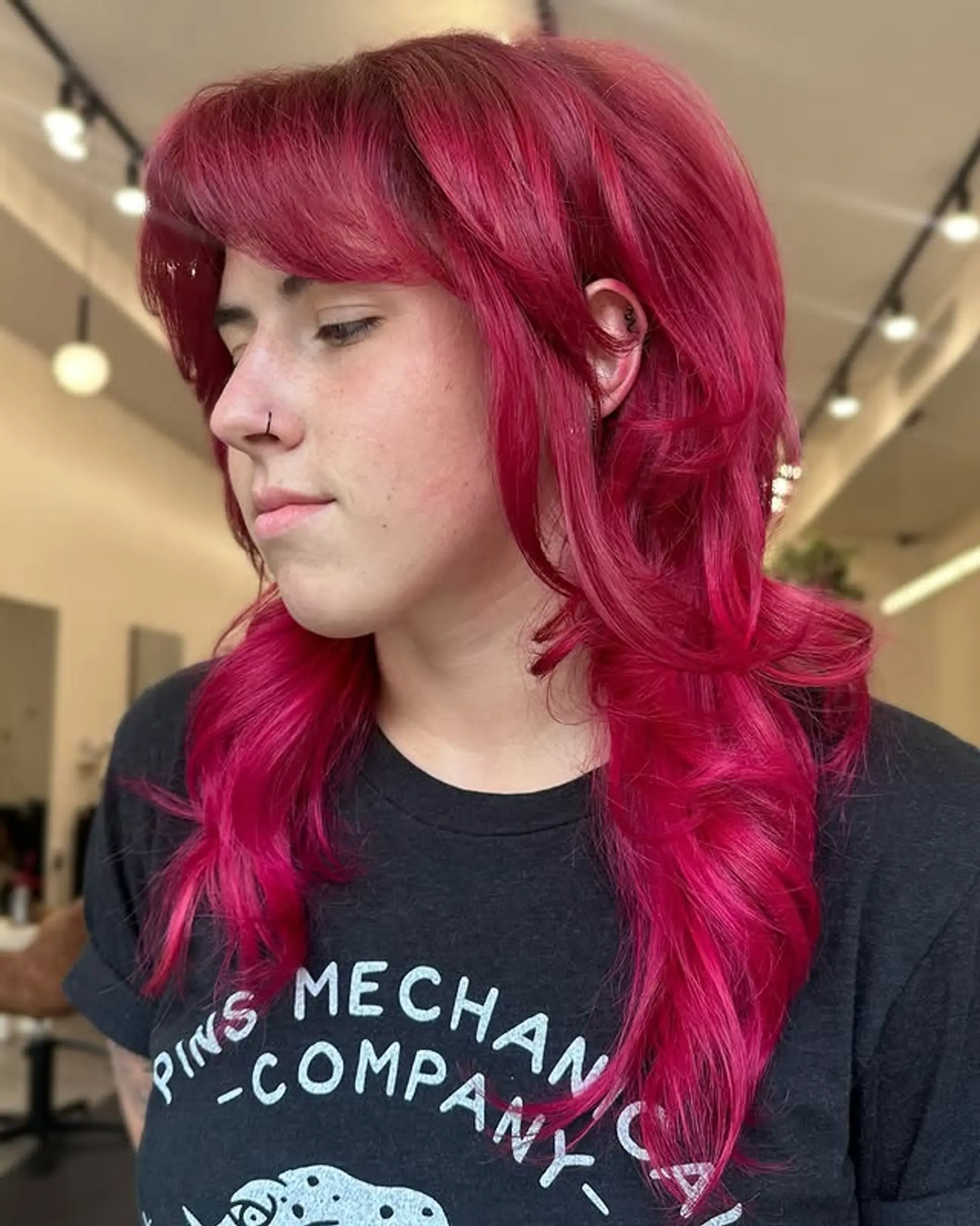 A trendy shag with layers and bangs, styled with a modern edgy vibe. 1