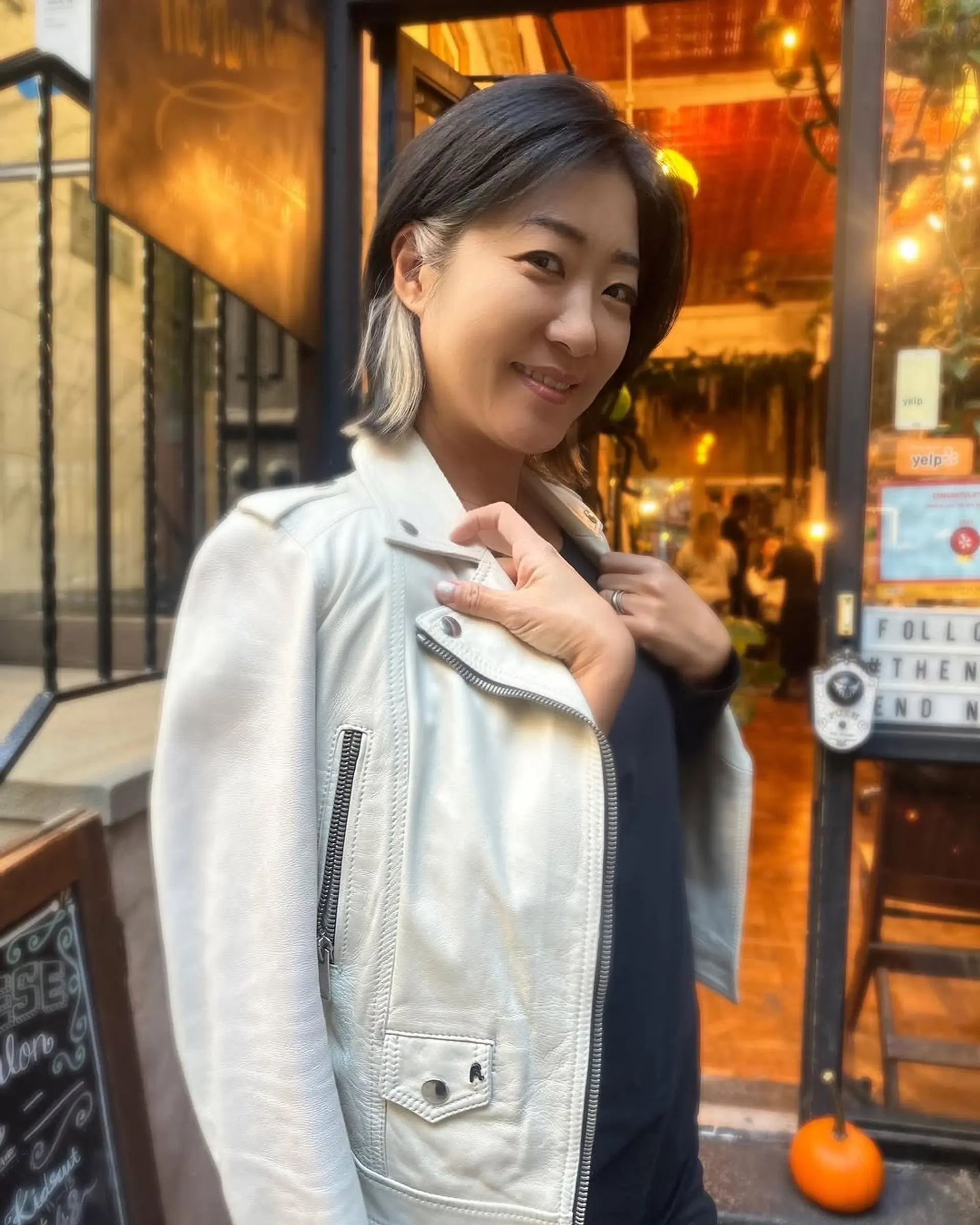 A short bob with contrasting money piece highlights. 1