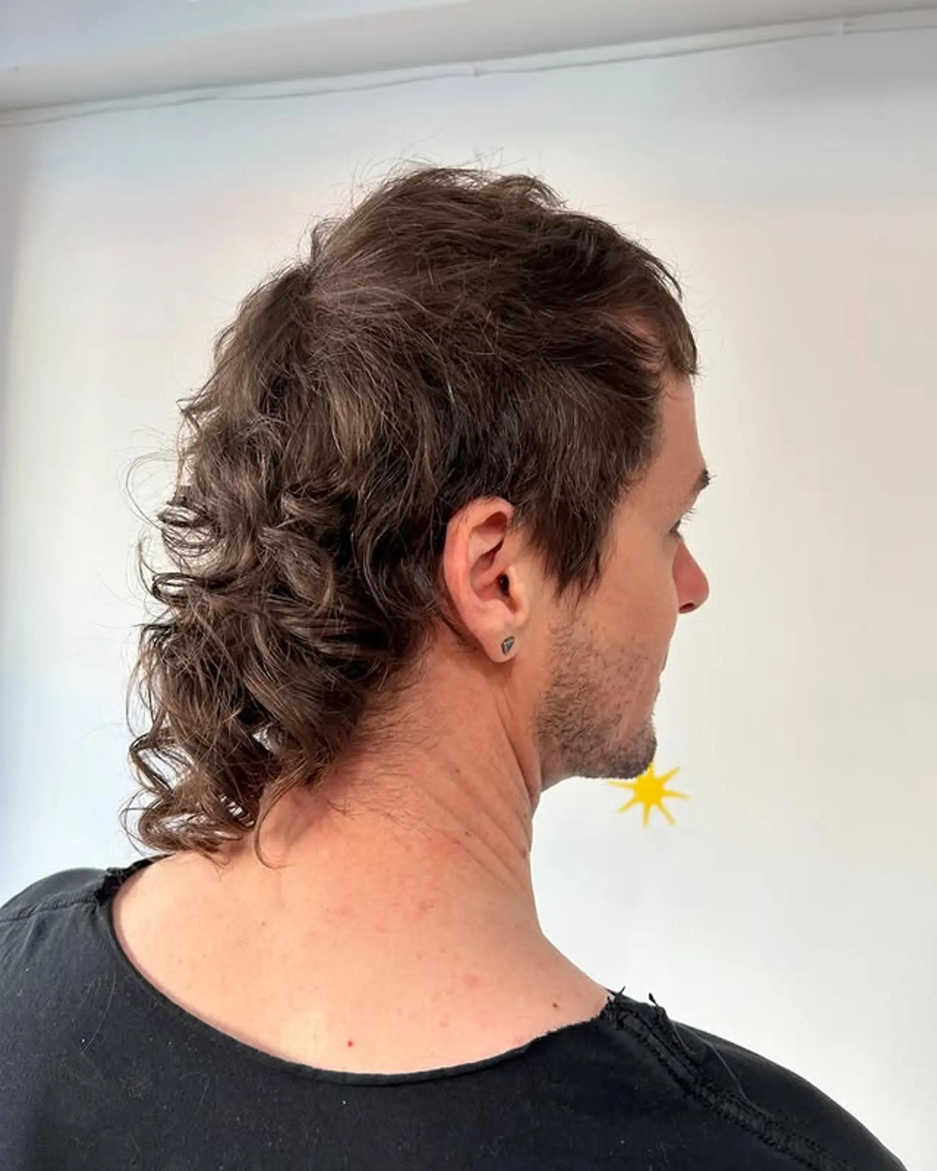 A modern take on the mullet with a curly texture. 1